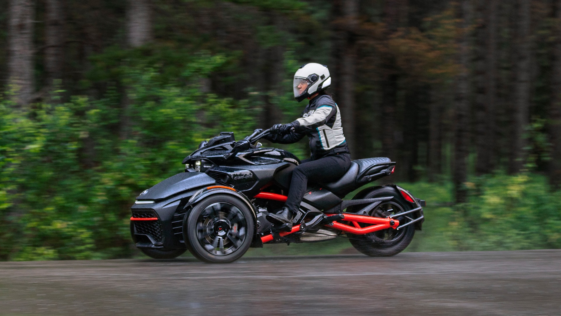 View of a Can-Am Spyder F3-S Naked Sport Cruiser on a wet road