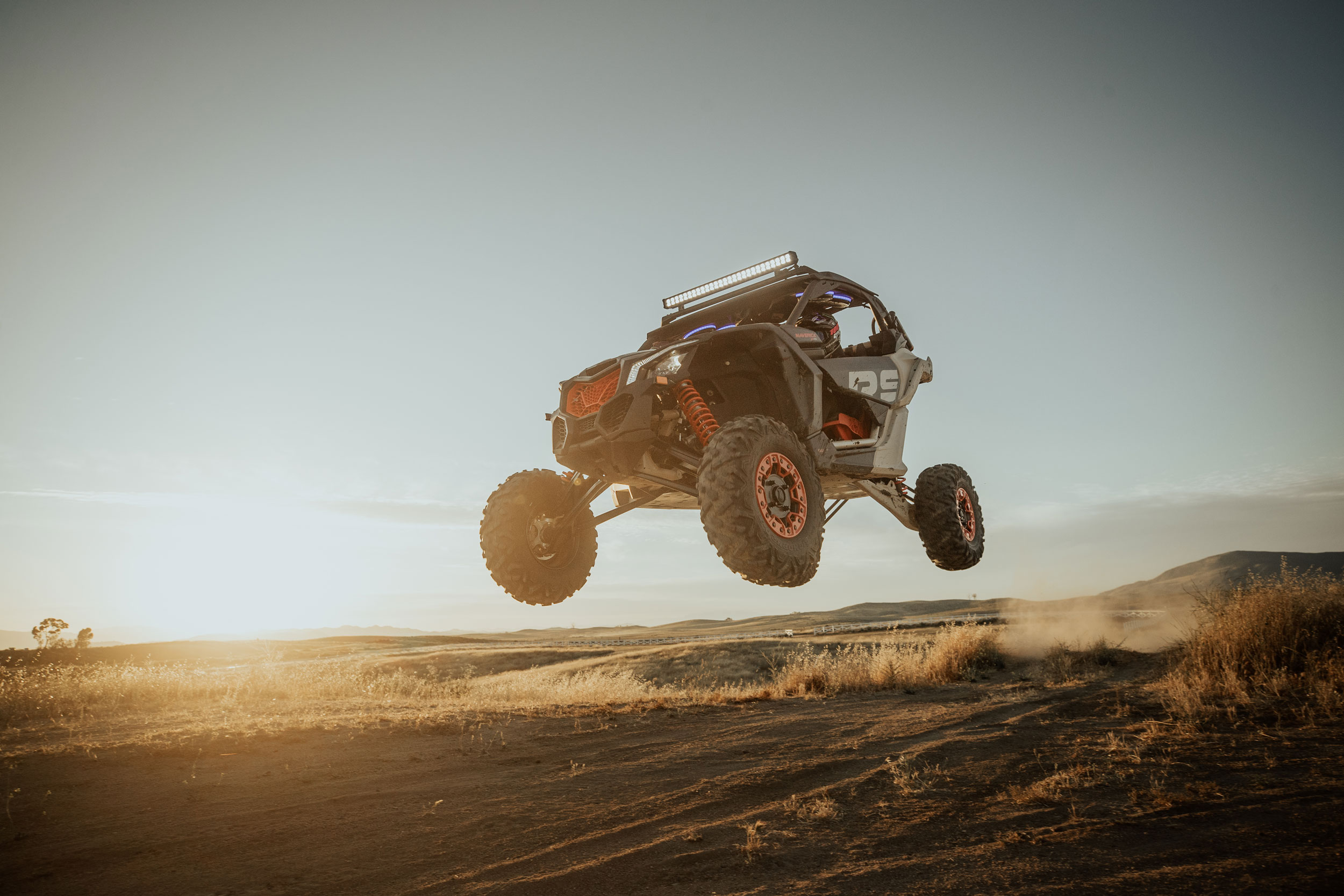 A Can-Am Maverick side-by-side in the air