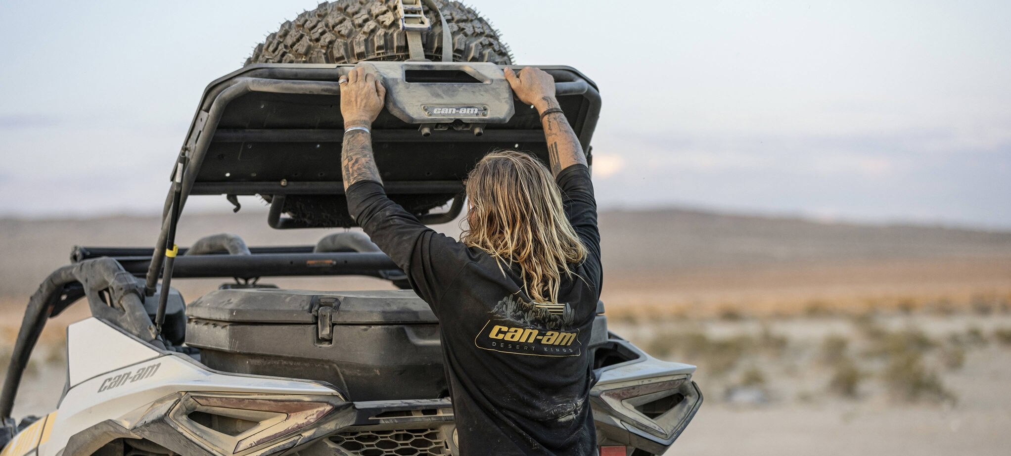 Can-Am ambassador Terry Madden lifting the trunk of his Maverick R SxS to access the LinQ cargo box