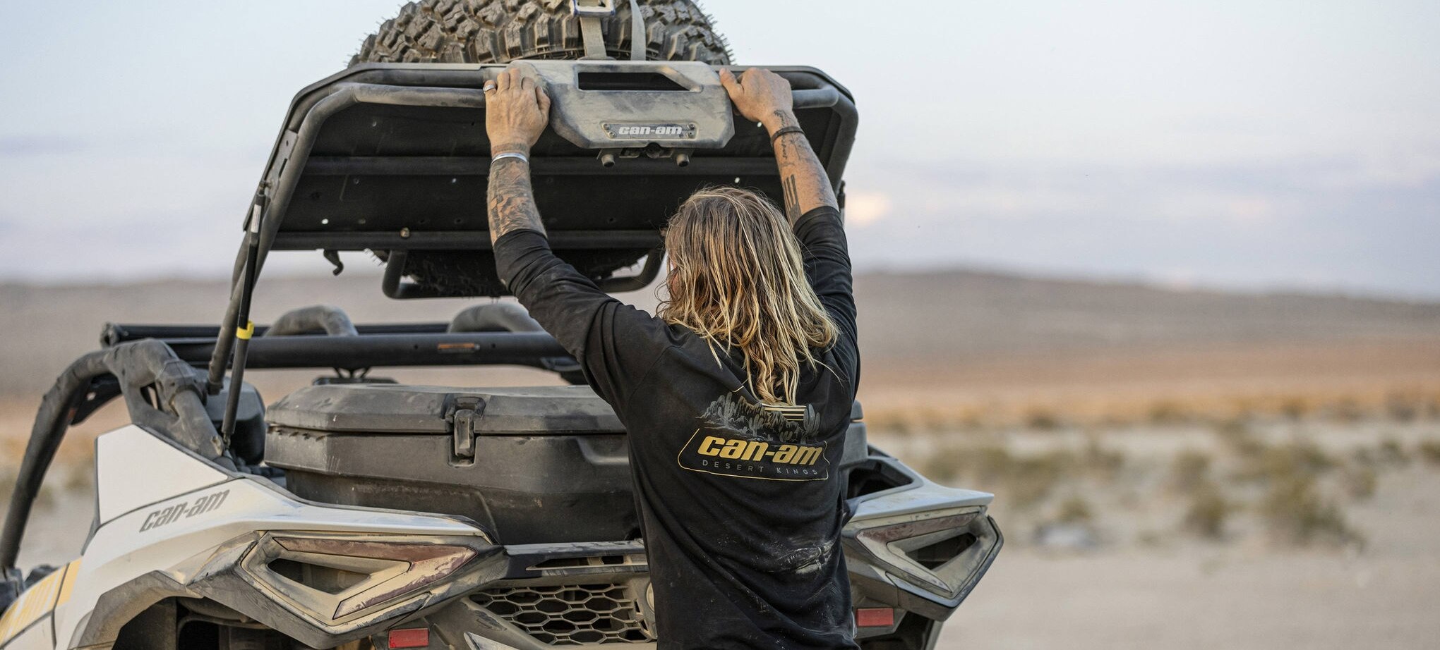 Can-Am ambassador Terry Madden lifting the trunk of his Maverick R SxS to access the LinQ cargo box