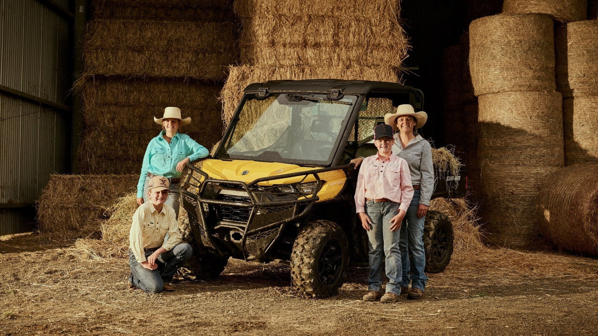 The McCulloch family posing next to a Can-Am Defender 