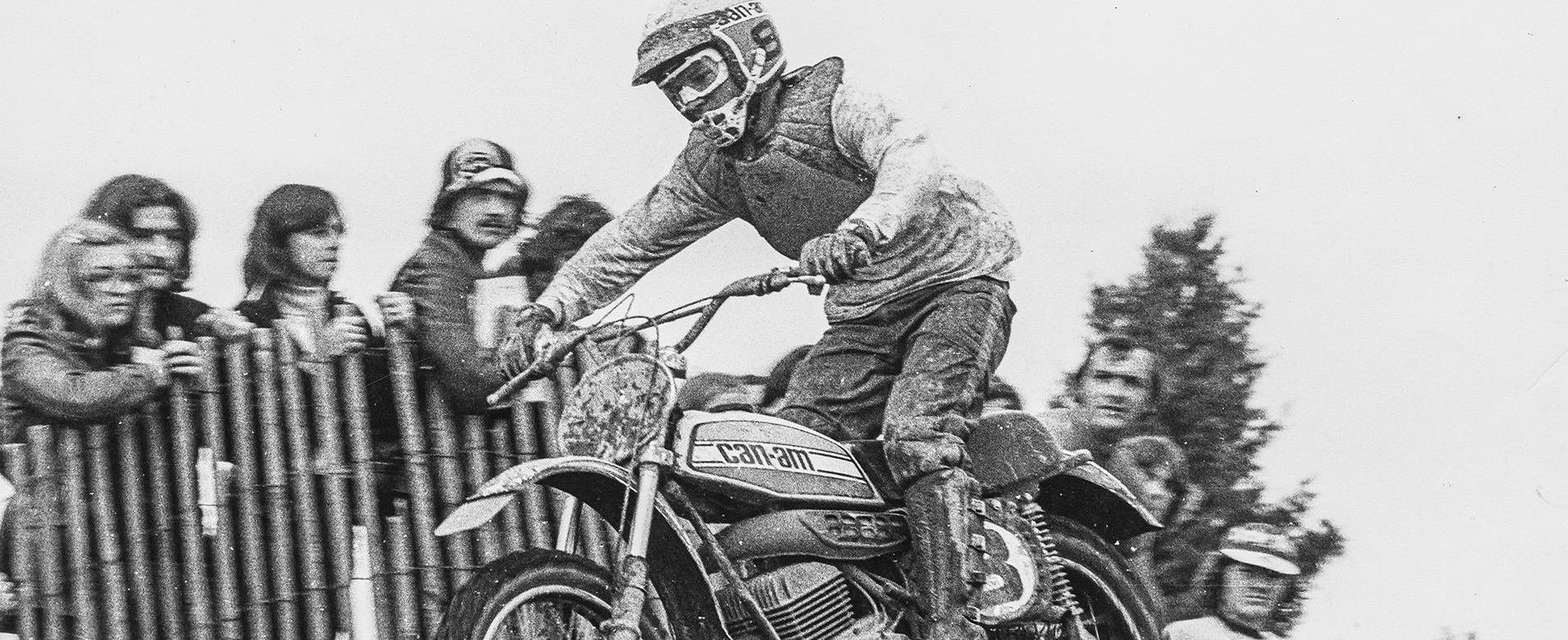 Motocross rider jumping with a classic Can-Am motorcycle