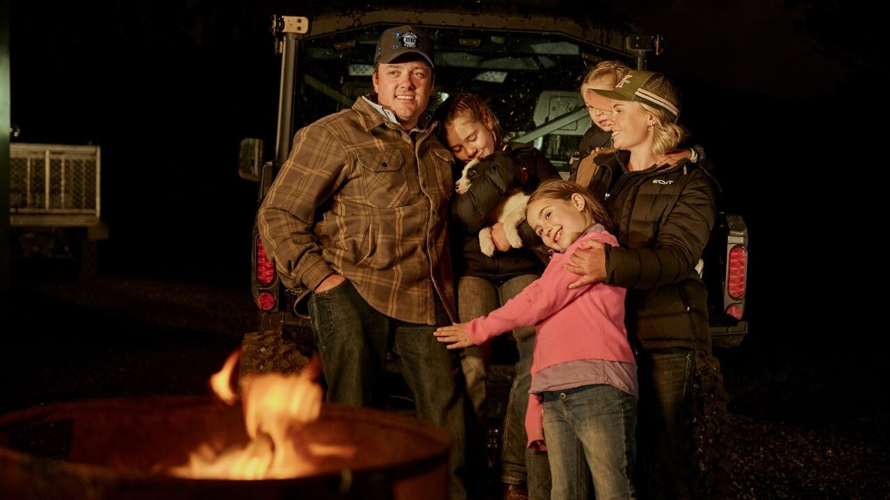 The Komacha family posing on the back of a Can-Am Defender