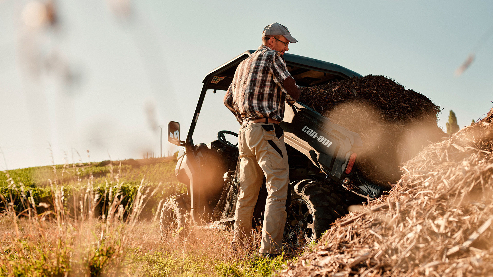 Farmer unloading his Can-Am Defender side-by-side