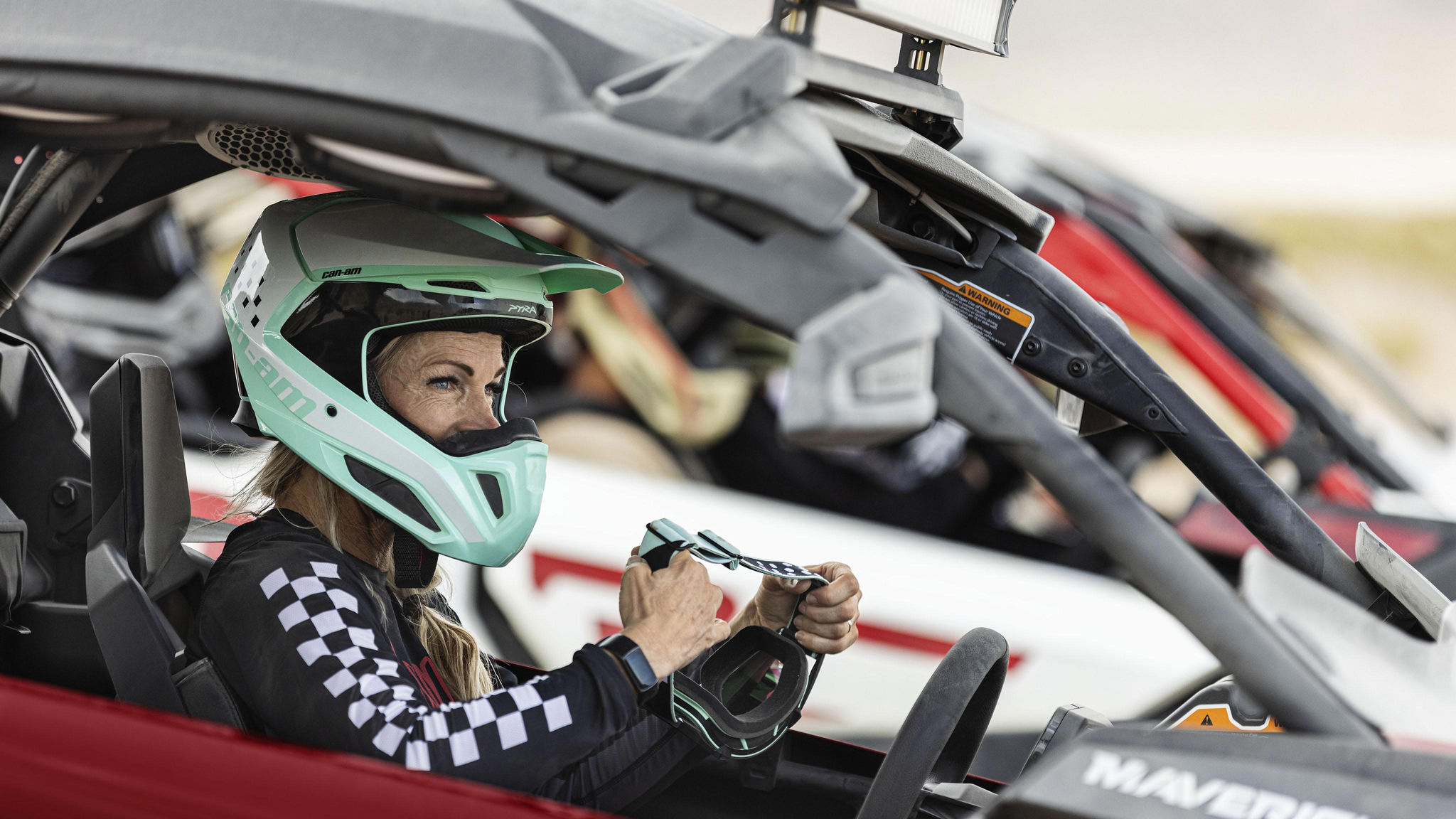 Can-Am Maverick X3 side-by-sides speeding in the desert.