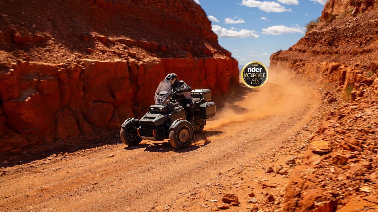 Rider driving a 2025 Can-Am Canyon Redrock on a desert dirt road