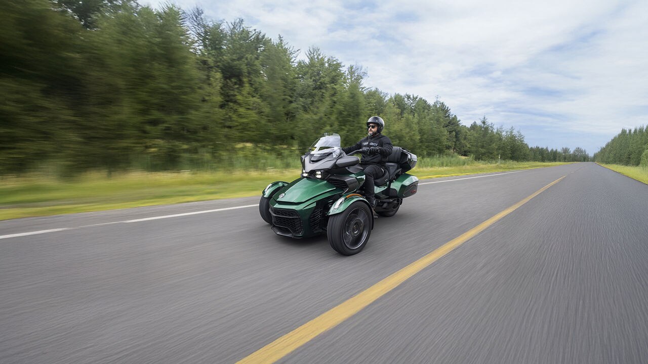 Can-Am 3-wheel vehicle on paved road