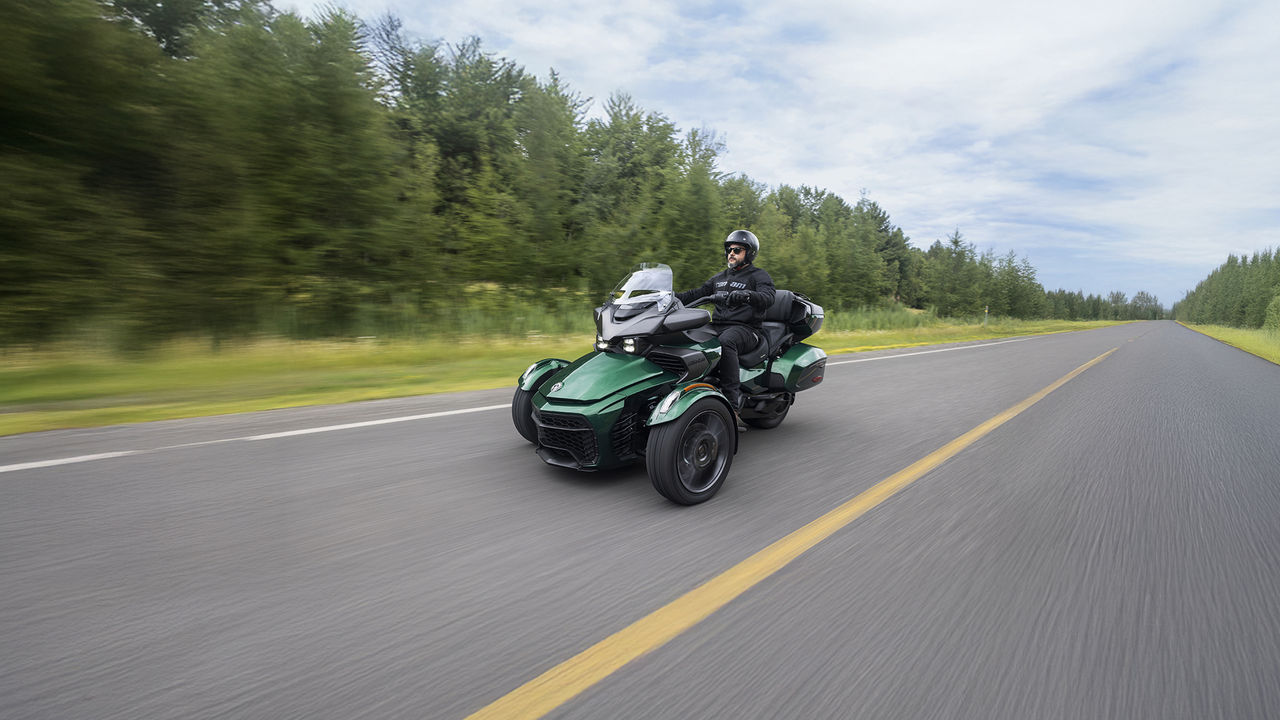 Can-Am 3-wheel vehicle on paved road