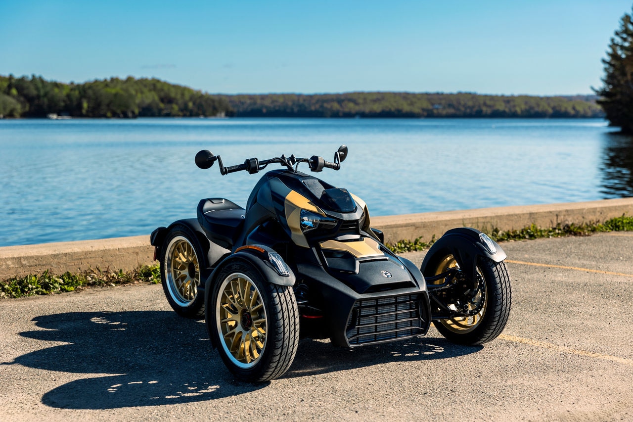 A Ryker can-am parked in front of a lake