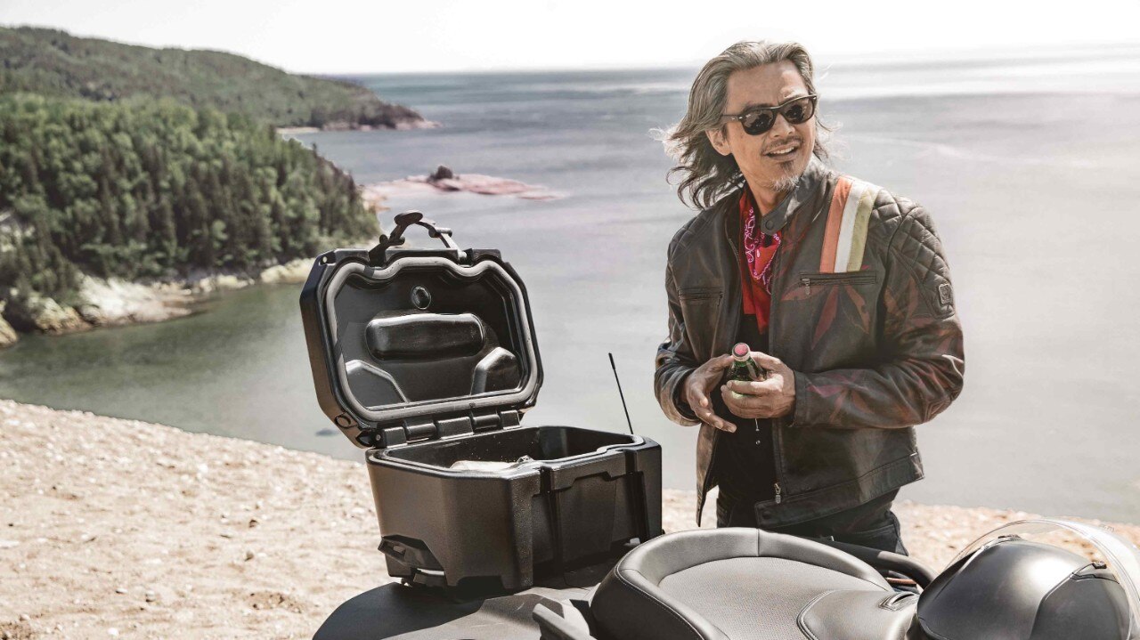 Rider enjoying a break beside the lake 