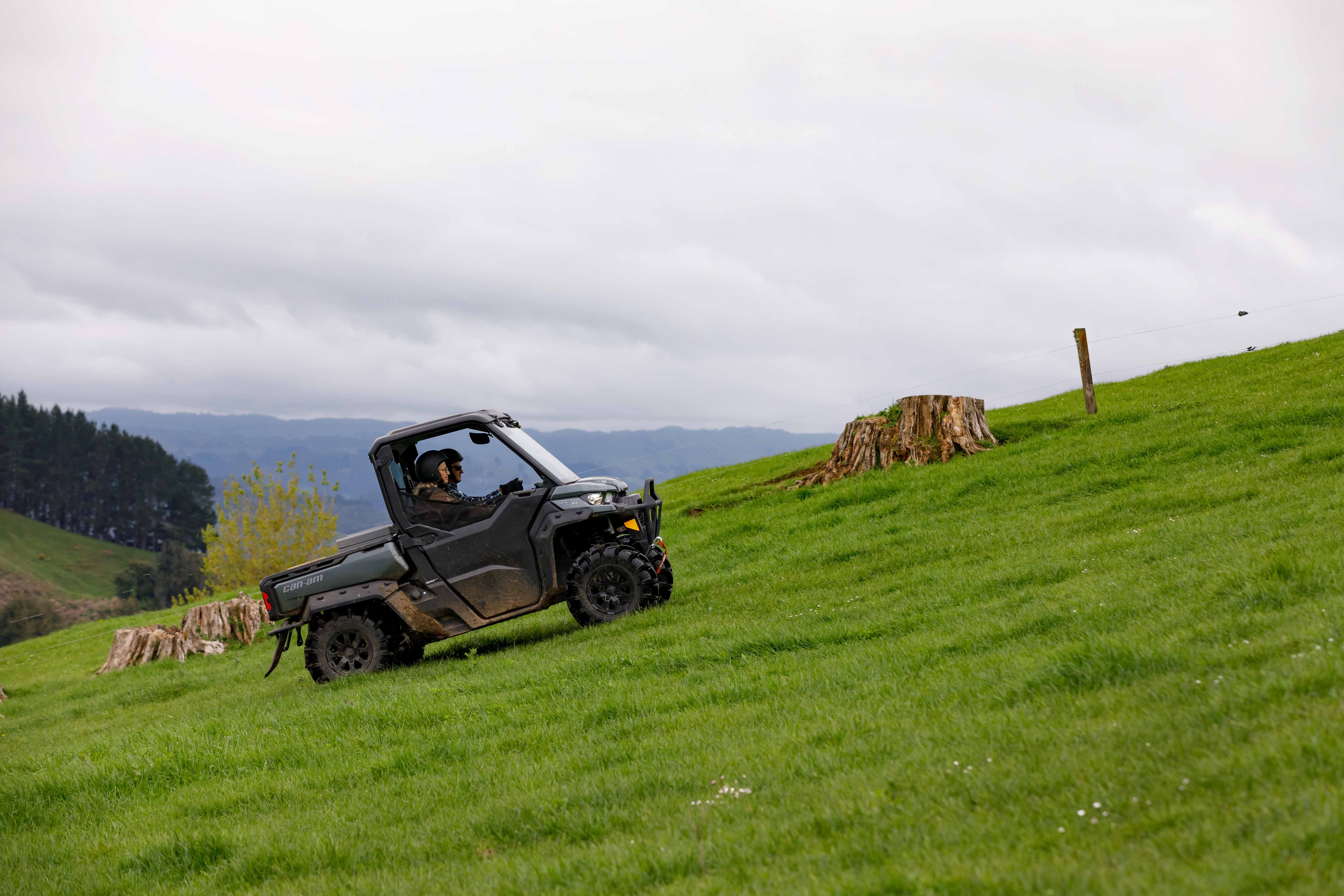 Can-Am Defender Limited who climbs a hill of grass