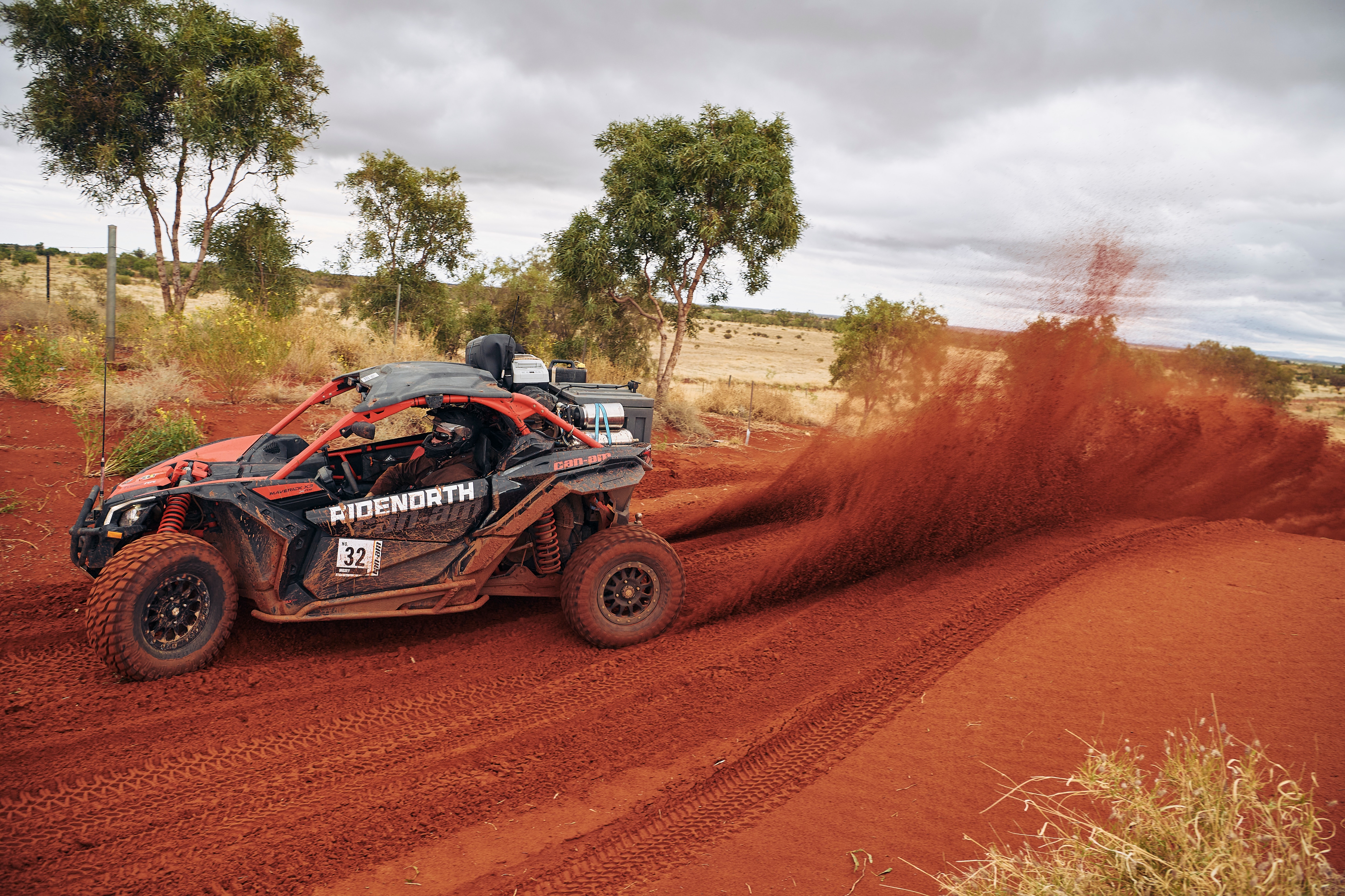 Can-Am Maverick X3 kicking up some red sand
