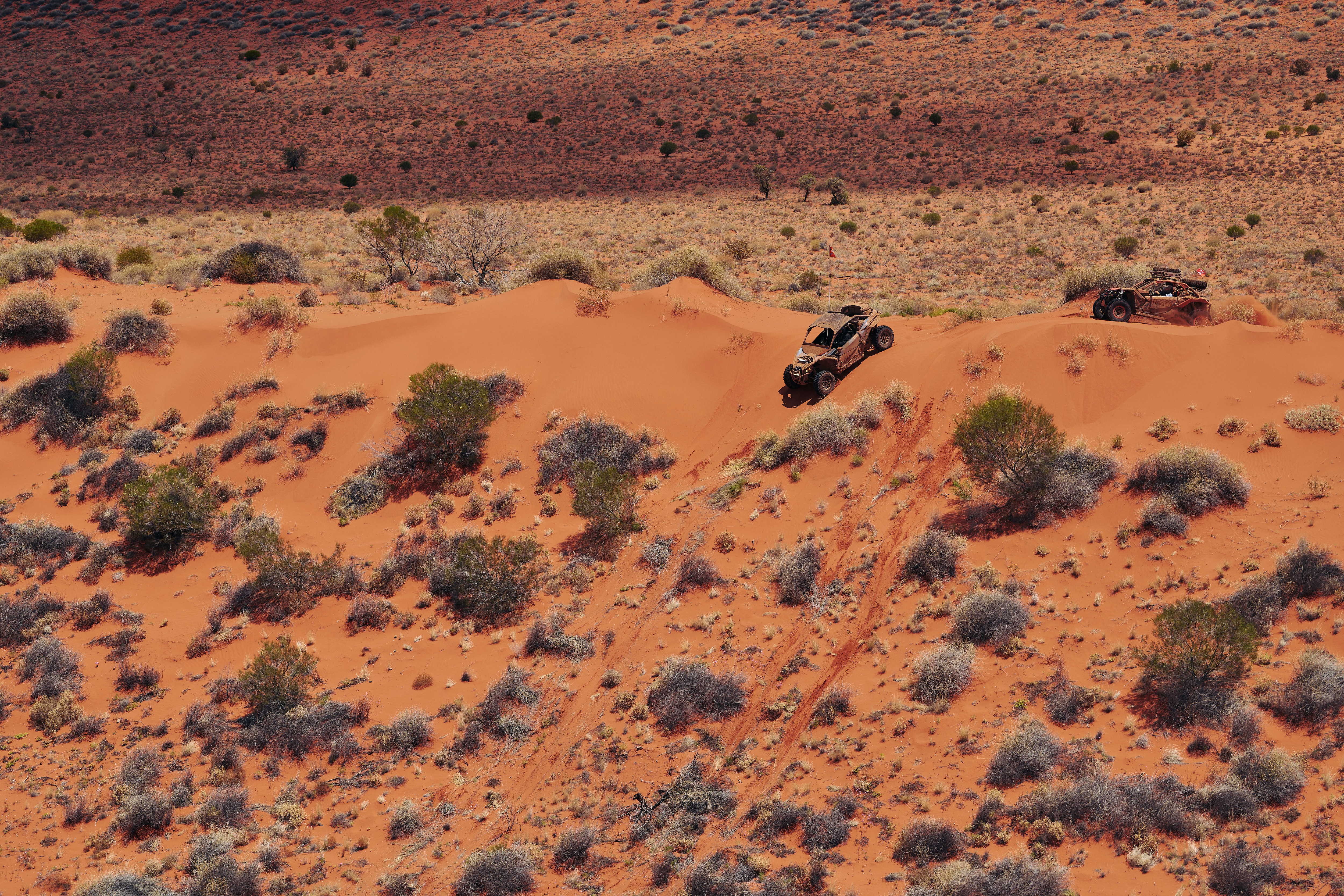 Can-Am Maverick X3 driving down the face of a sand dune