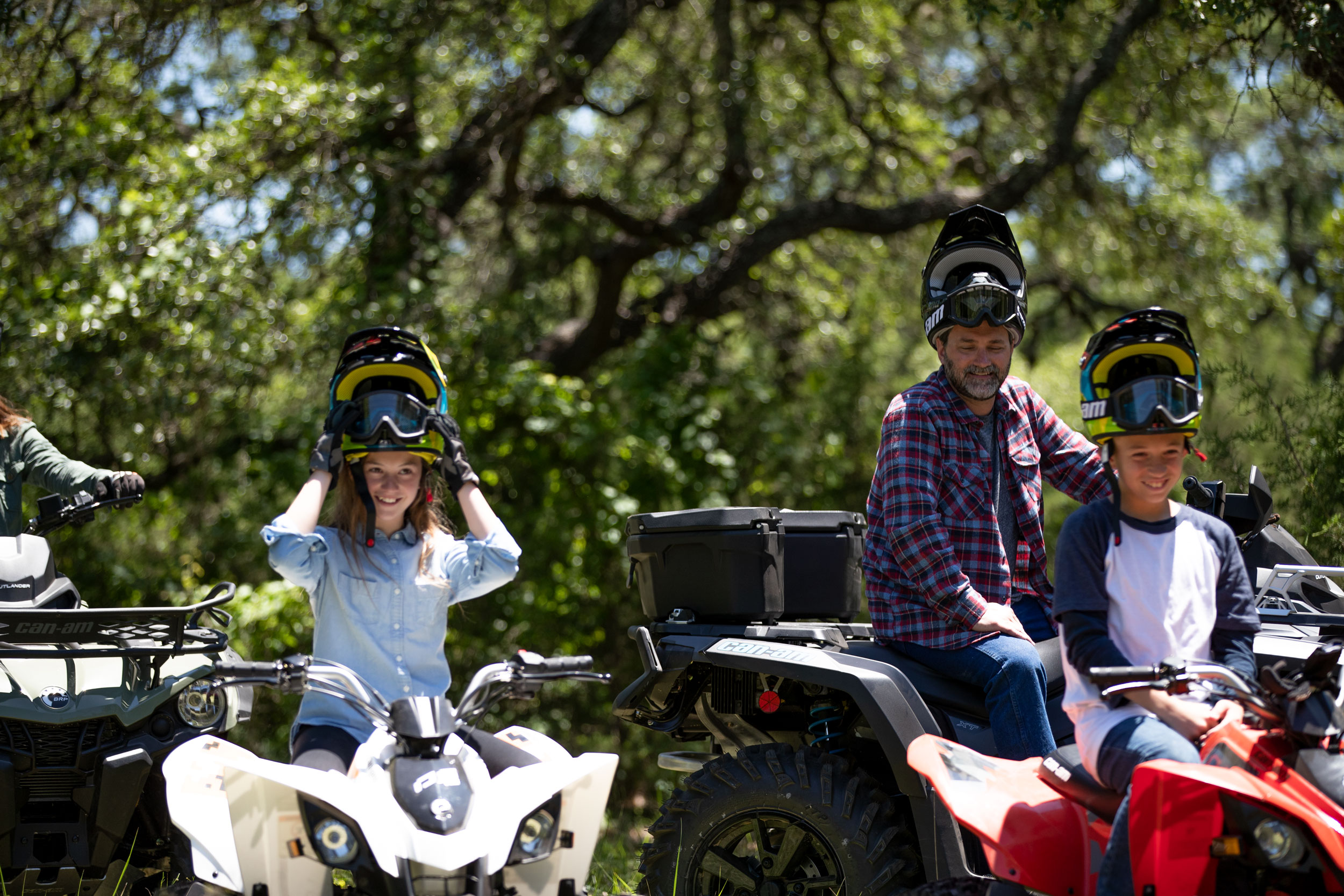 A family with their Can-Am vehicles