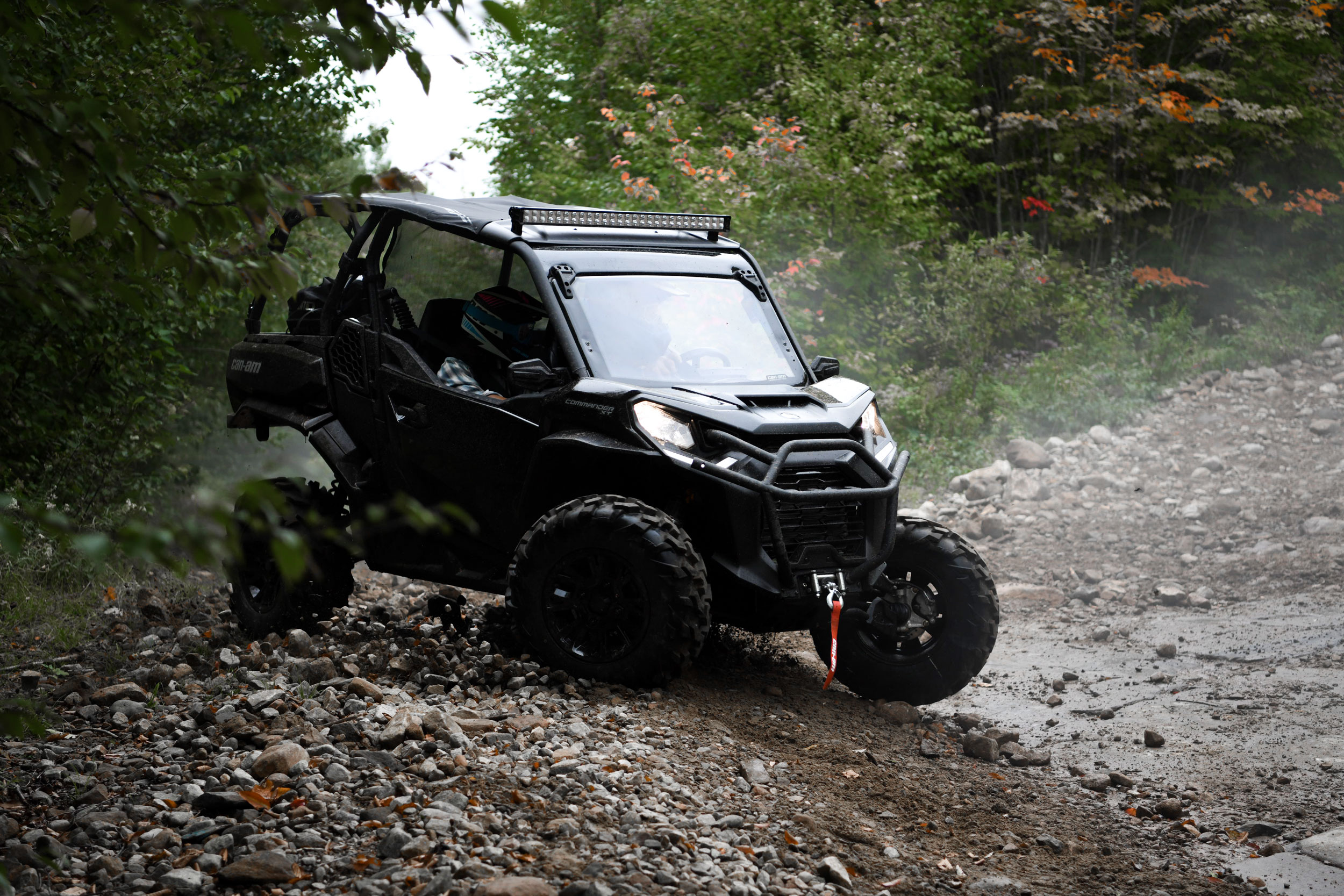 Can-Am Off-Road Commander Side by side vehicle on trail adventure
