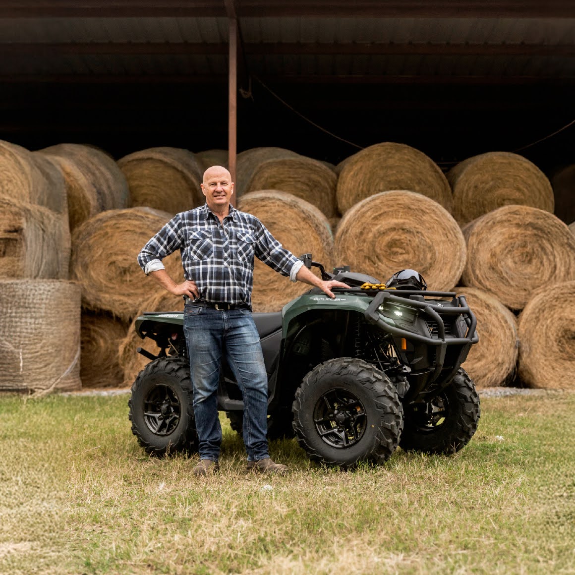 Sir David Fagan standing next to a Can-Am Outlander
