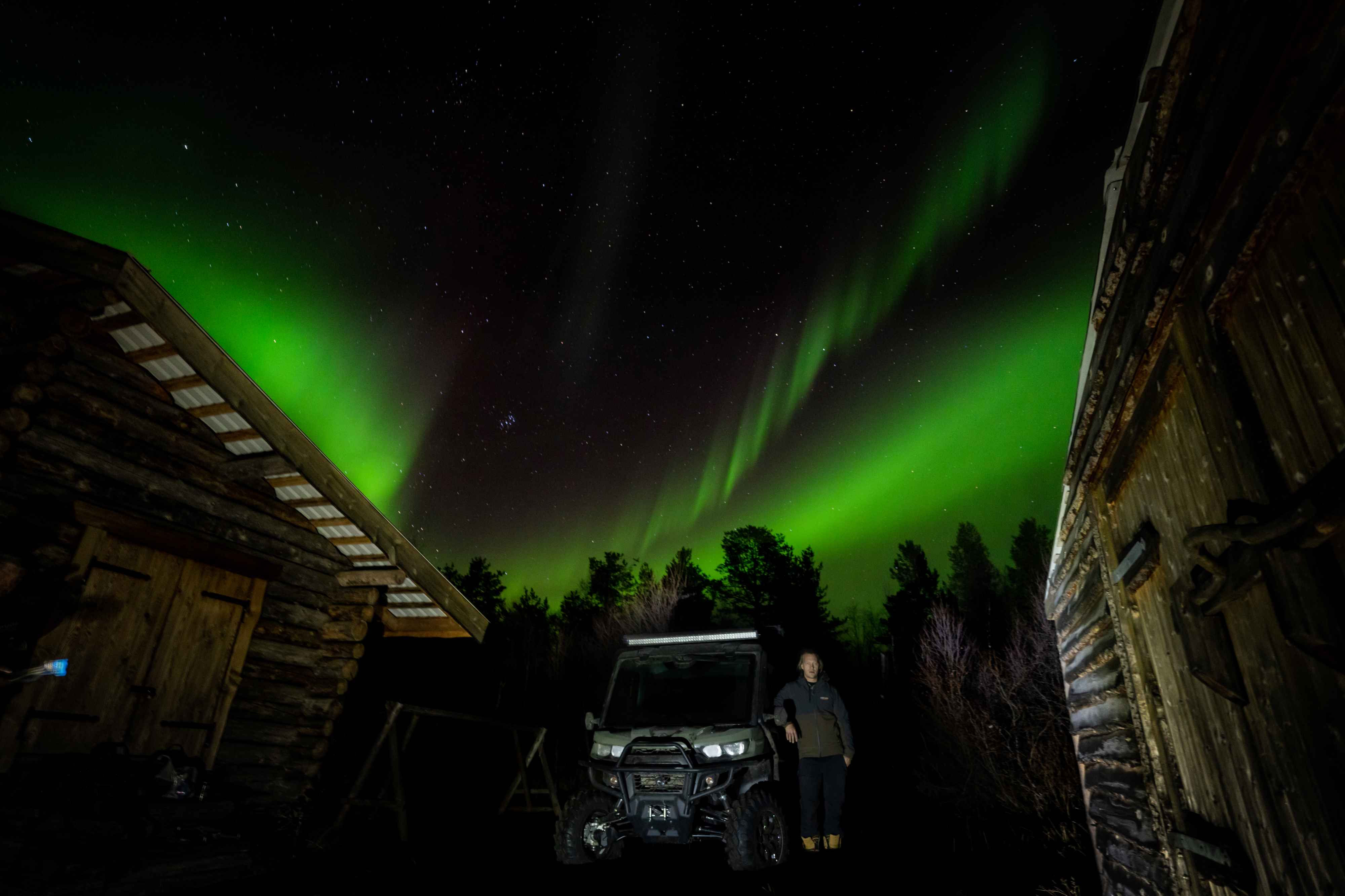 Jukka Hilden and Can-Am Traxter in front of the Northern Lights in Finland 