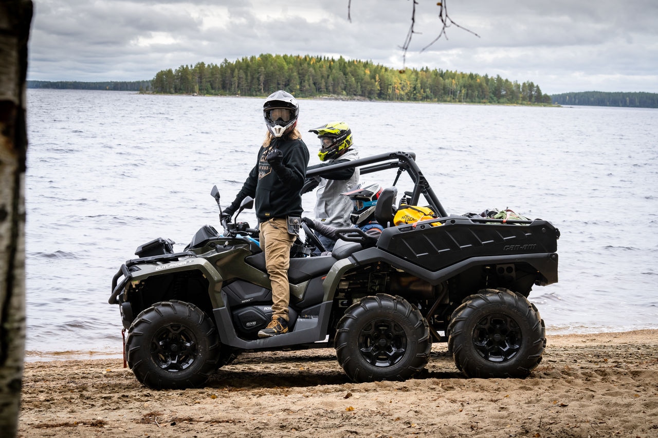 Jukka Hilden and Biisonimafia on a Can-Am ATV and SSV next to a lake