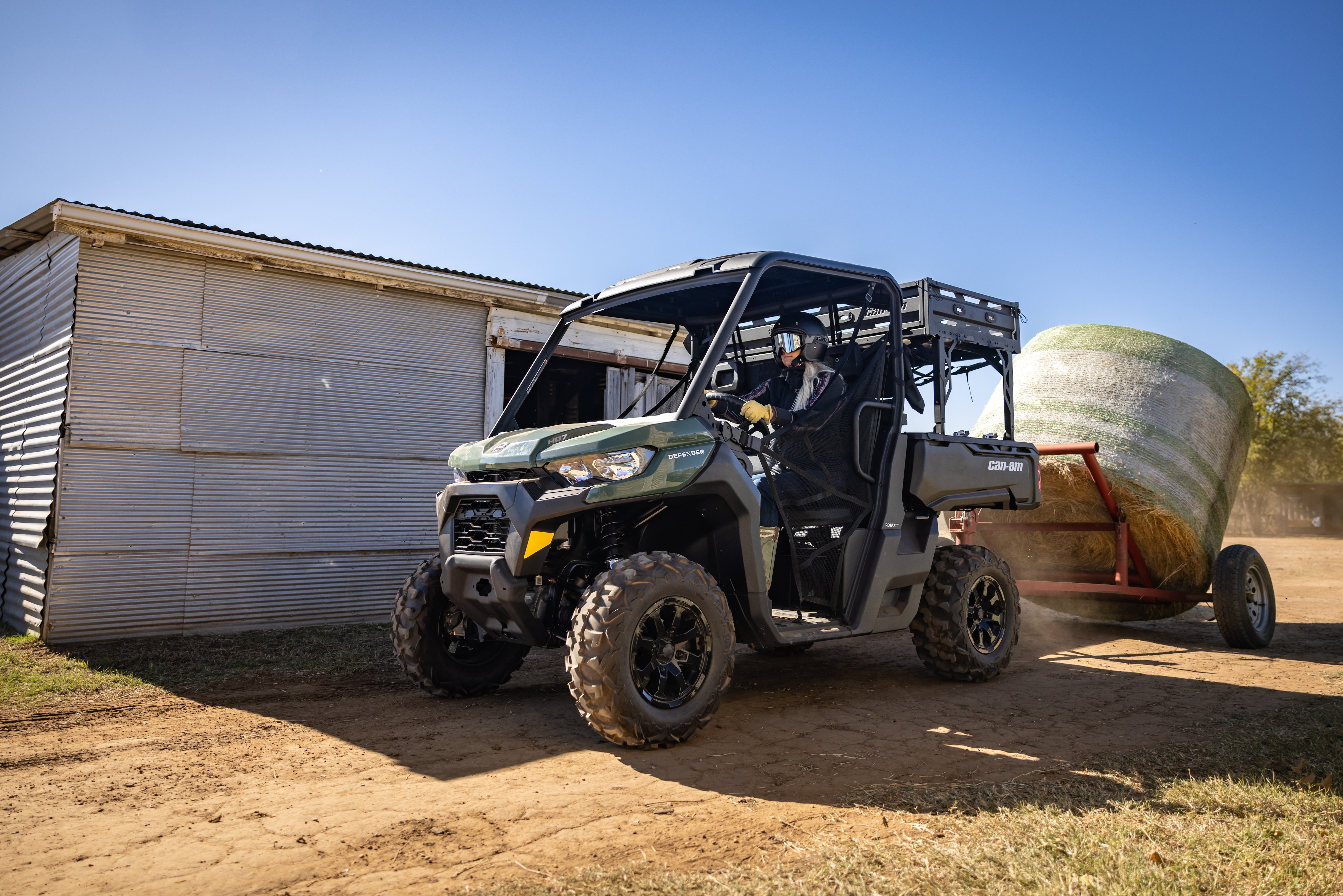 2024 Can-Am Defender MAX Limited SxS pulling a fully loaded trailer