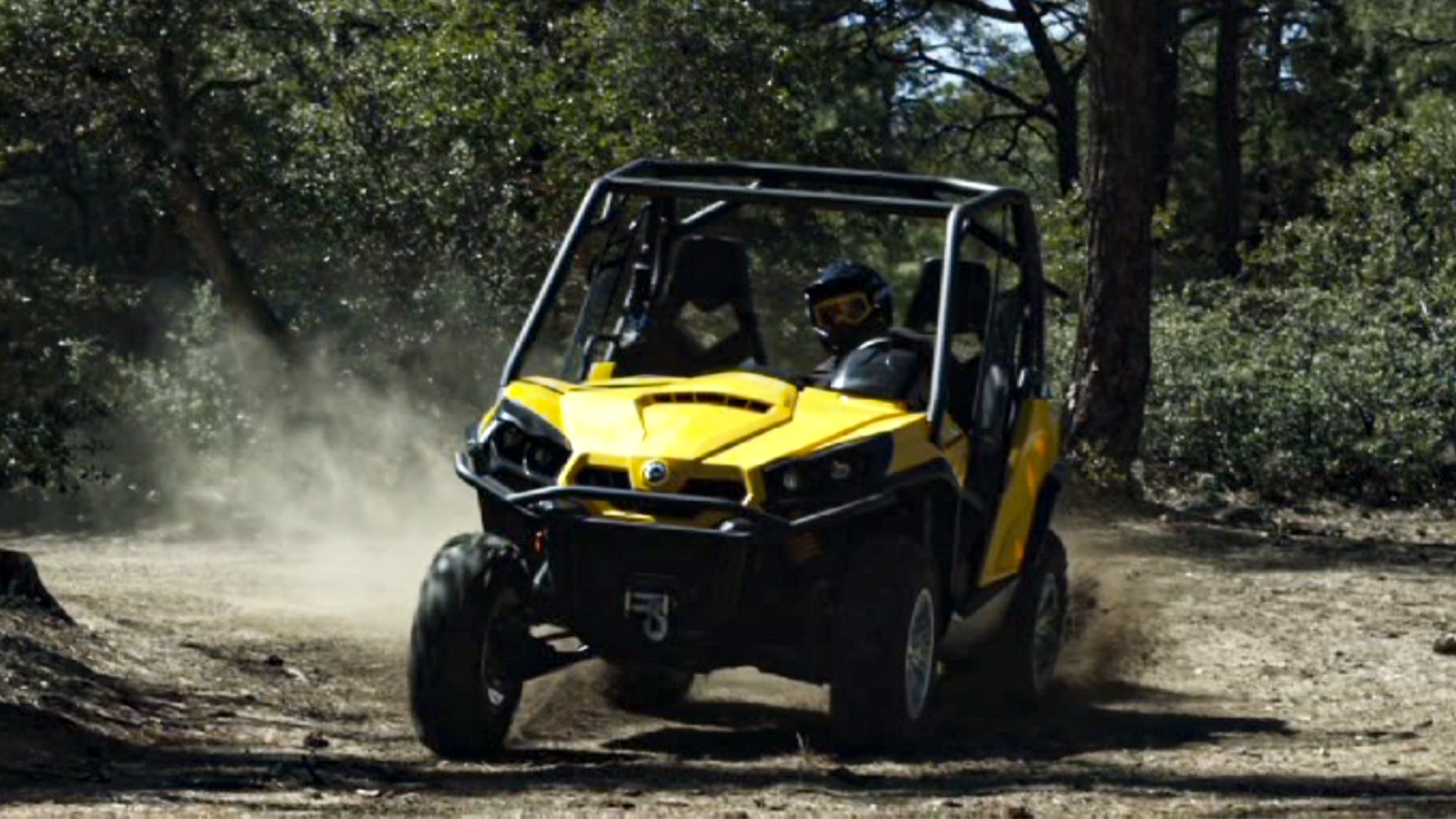 A 2011 Can-Am Commander SxS riding in a forest