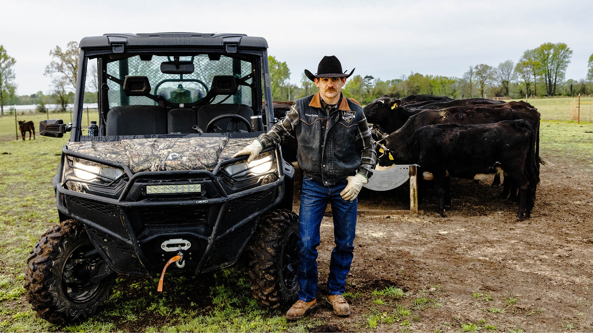 Multi-time champion bull rider Chase Outlaw next to his Can-Am SxS Defender