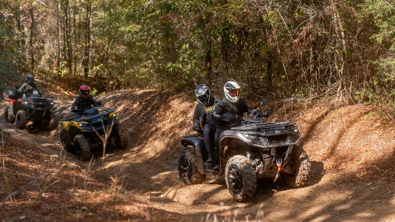 Friends trail riding on Can-Am Outlanders
