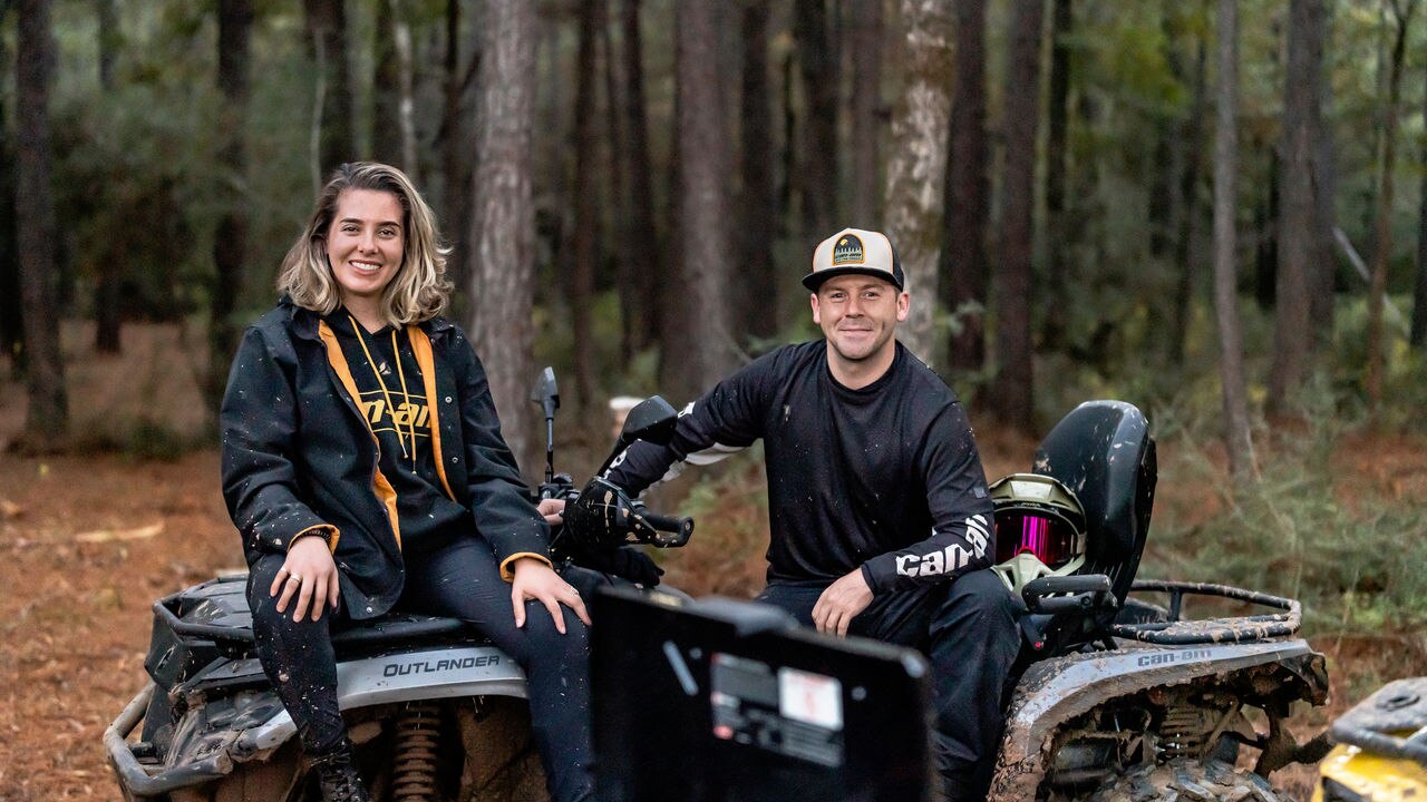 Riders sitting on their Can-Am Outlander 700 ATV