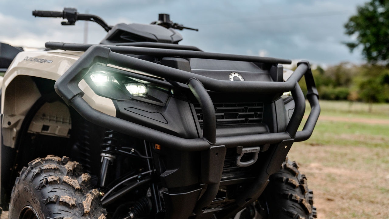 A farmer checking on his cattle with his Can-Am Outlander PRO