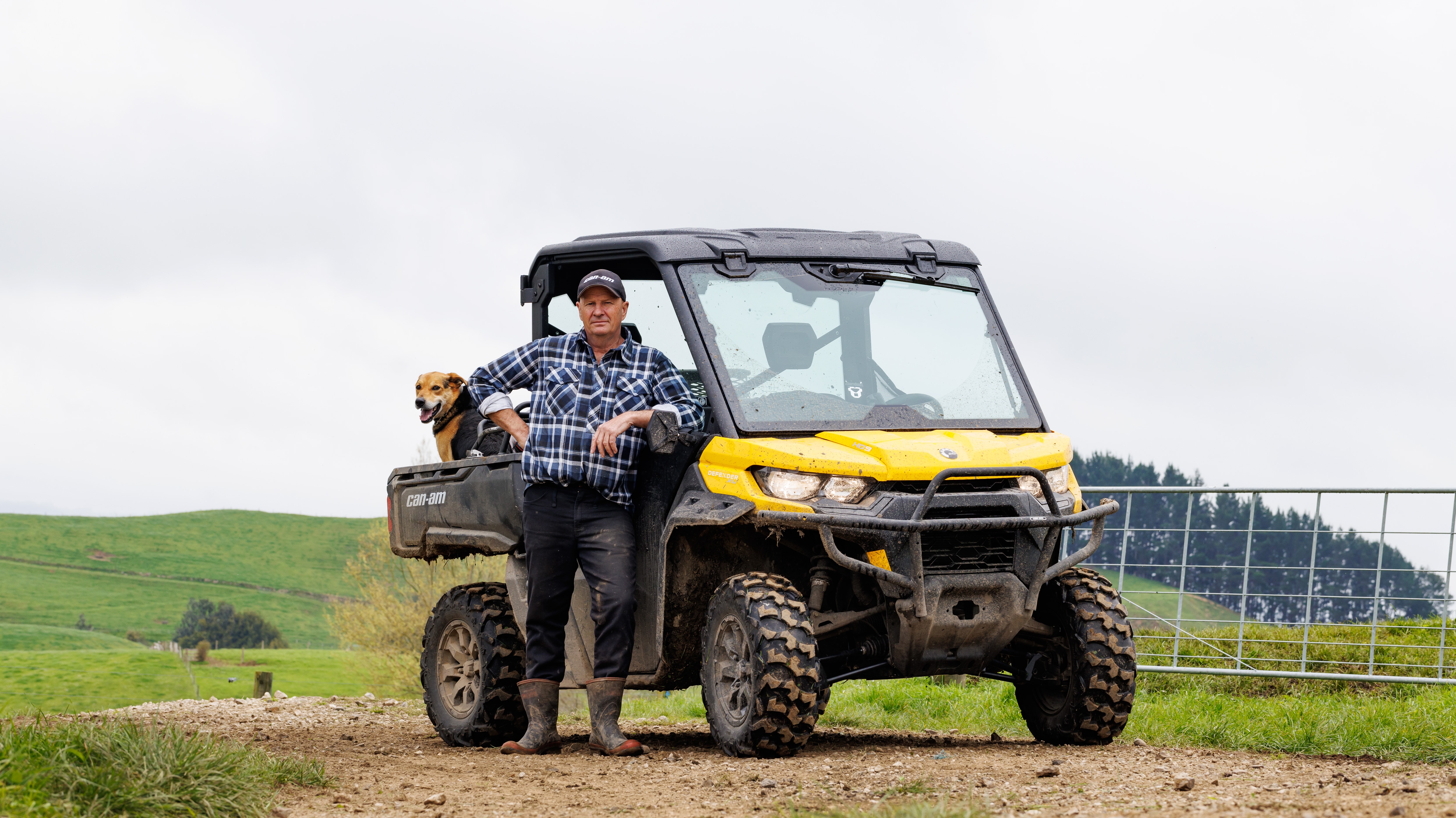 Farmer standing next to a Can-Am Defender
