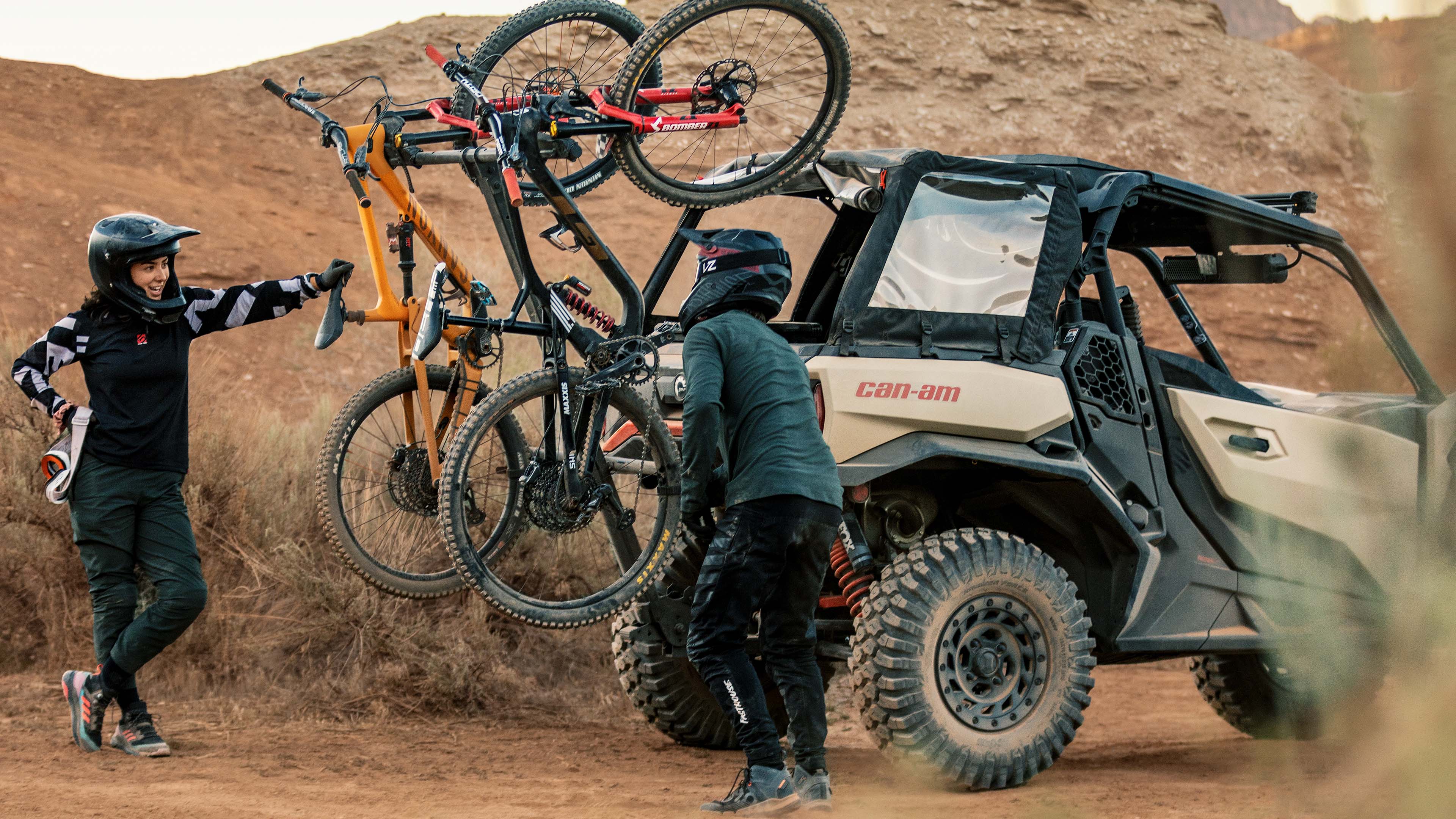 Friends loading up mountain bikes onto a Commander