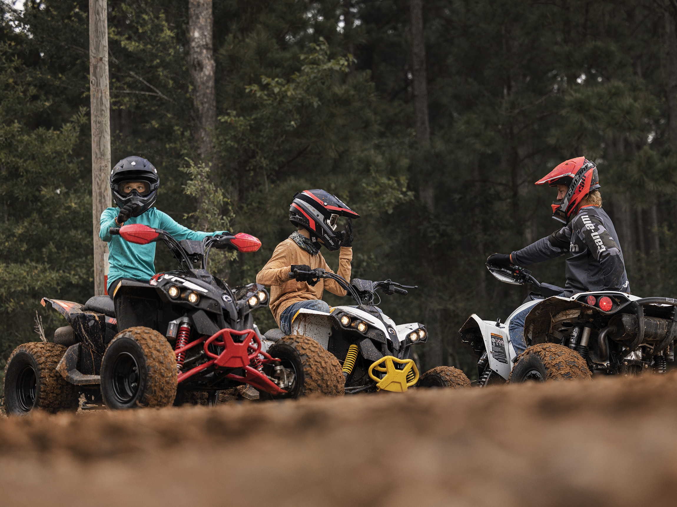 Can-Am Ambassador Dustin Jones supervising two youth on quads