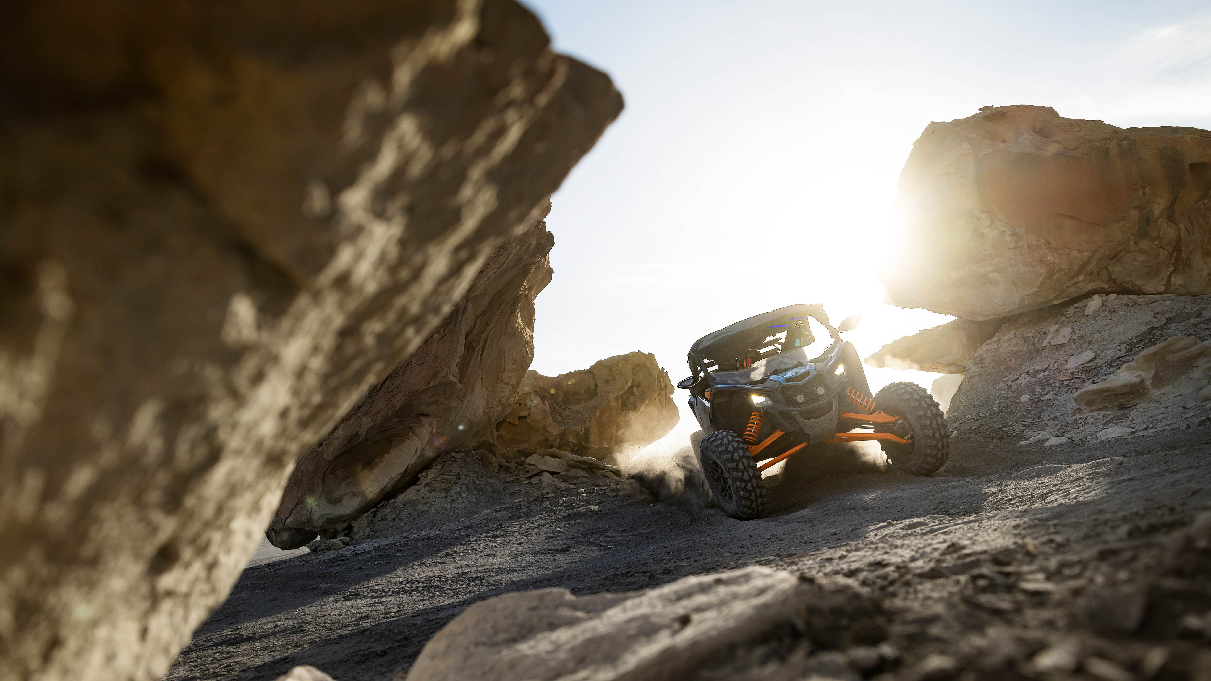 A Can-Am Maverick X3 MAX RS Turbo 2025, rolling between the rocks