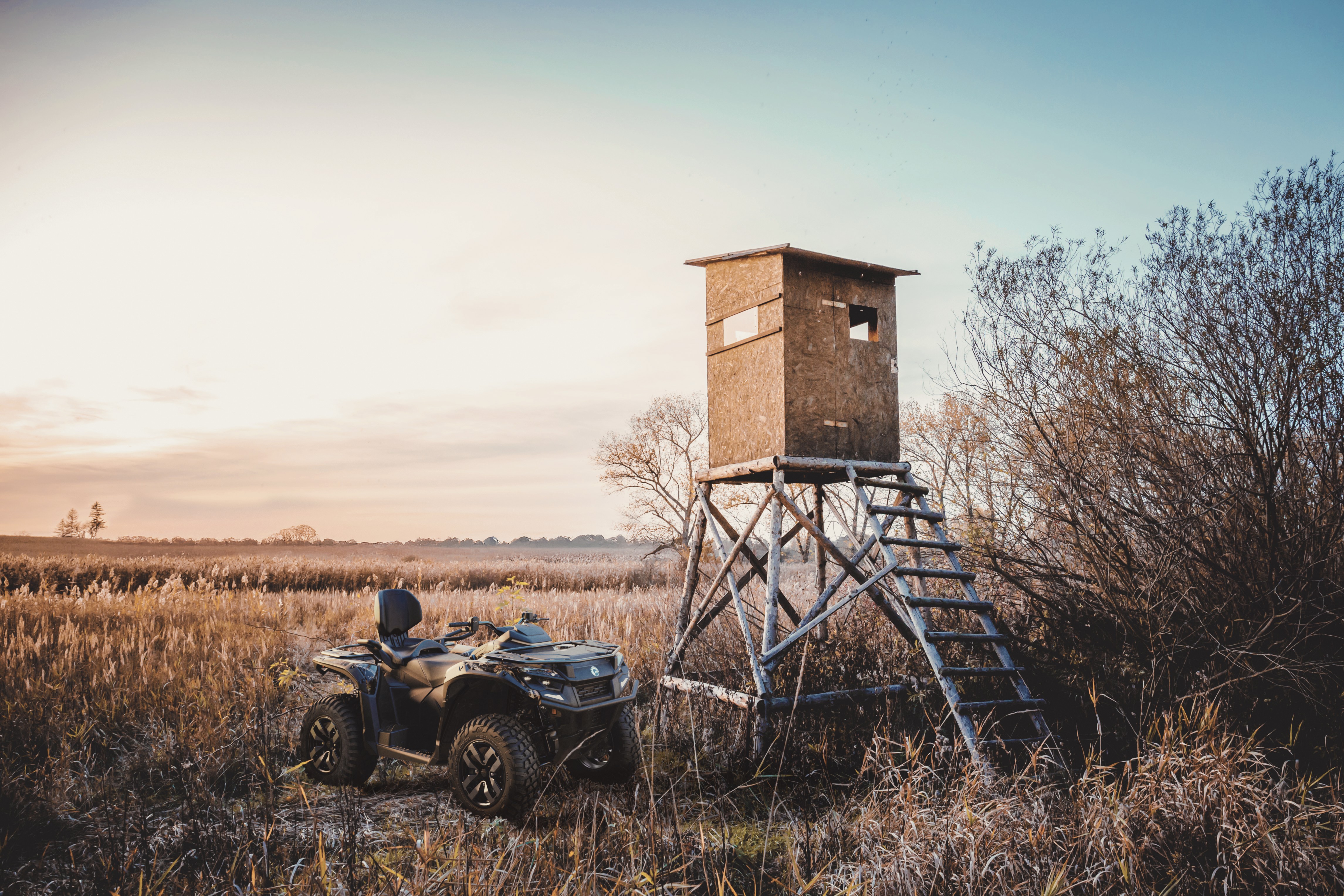 A 2026 Can-Am Outlander Electric near a hunting blind