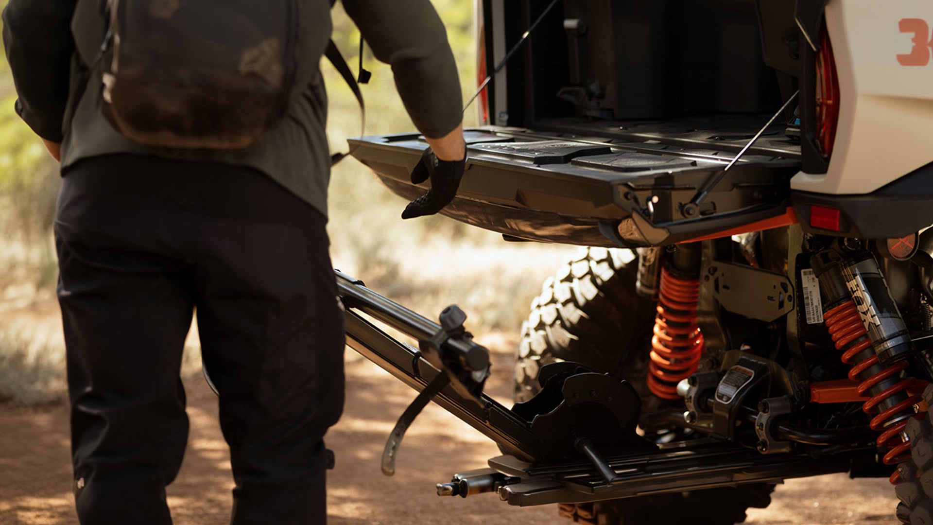 How to adjust SxS shocks on my Can-Am vehicle?