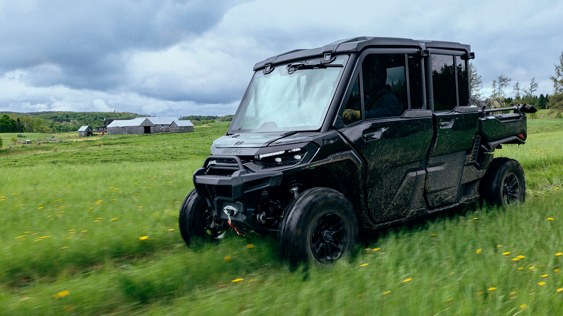 A Can-Am Defender HD11 2026 MAX Lonestar side-by-side vehicle on a farm