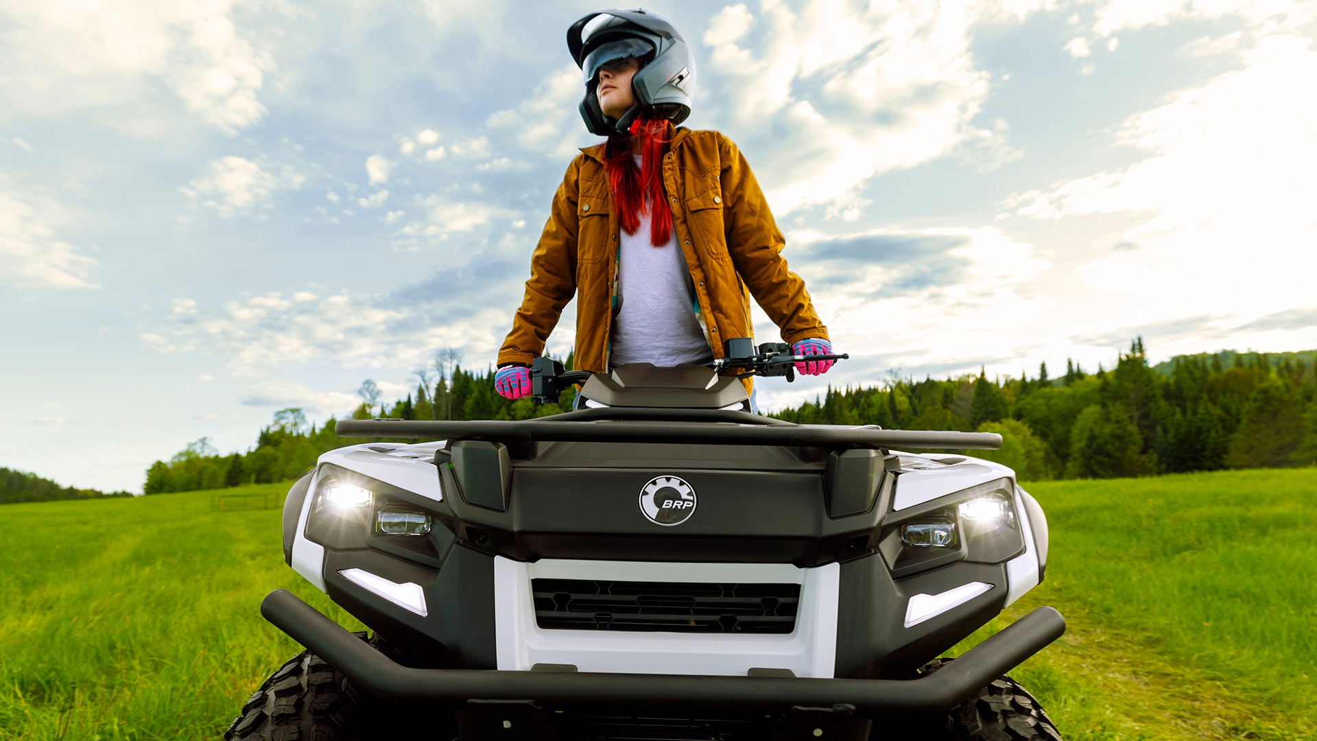 A driver on her brand-new 2026 Outlander Electric 2026 all-terrain vehicle