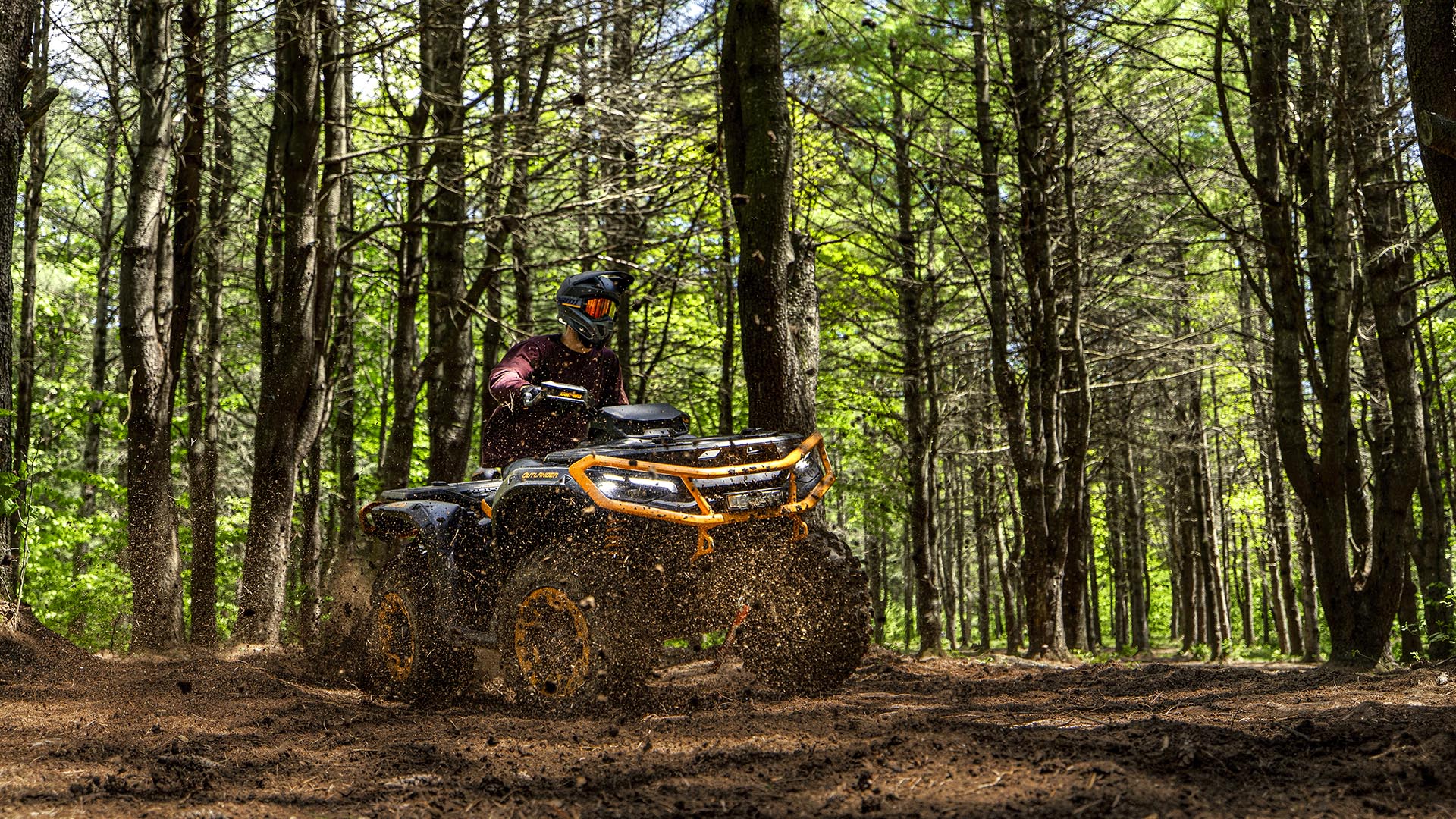 2026 Can-Am Outlander 850/1000r XTP with enhanced control, riding in a forest
