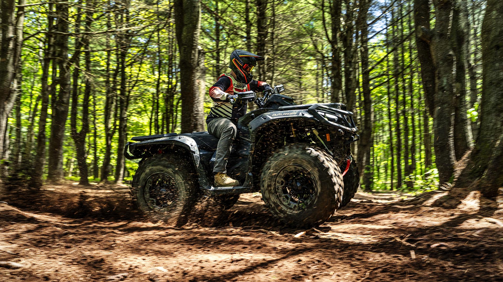 2026 Can-Am Outlander 850/1000r with stability and comfort, riding in a forest
