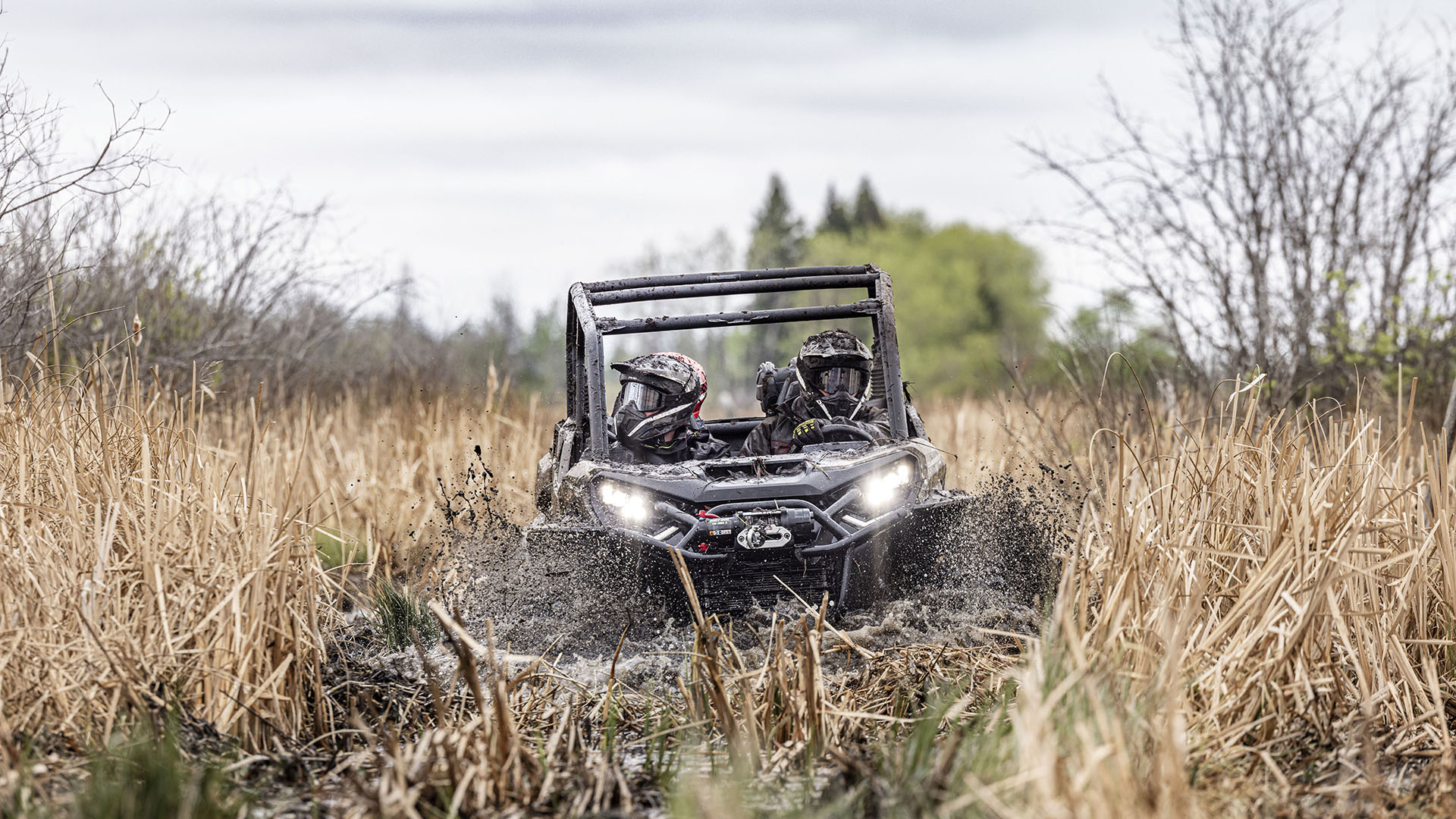 2024 Can-Am Commander riding in deep mud