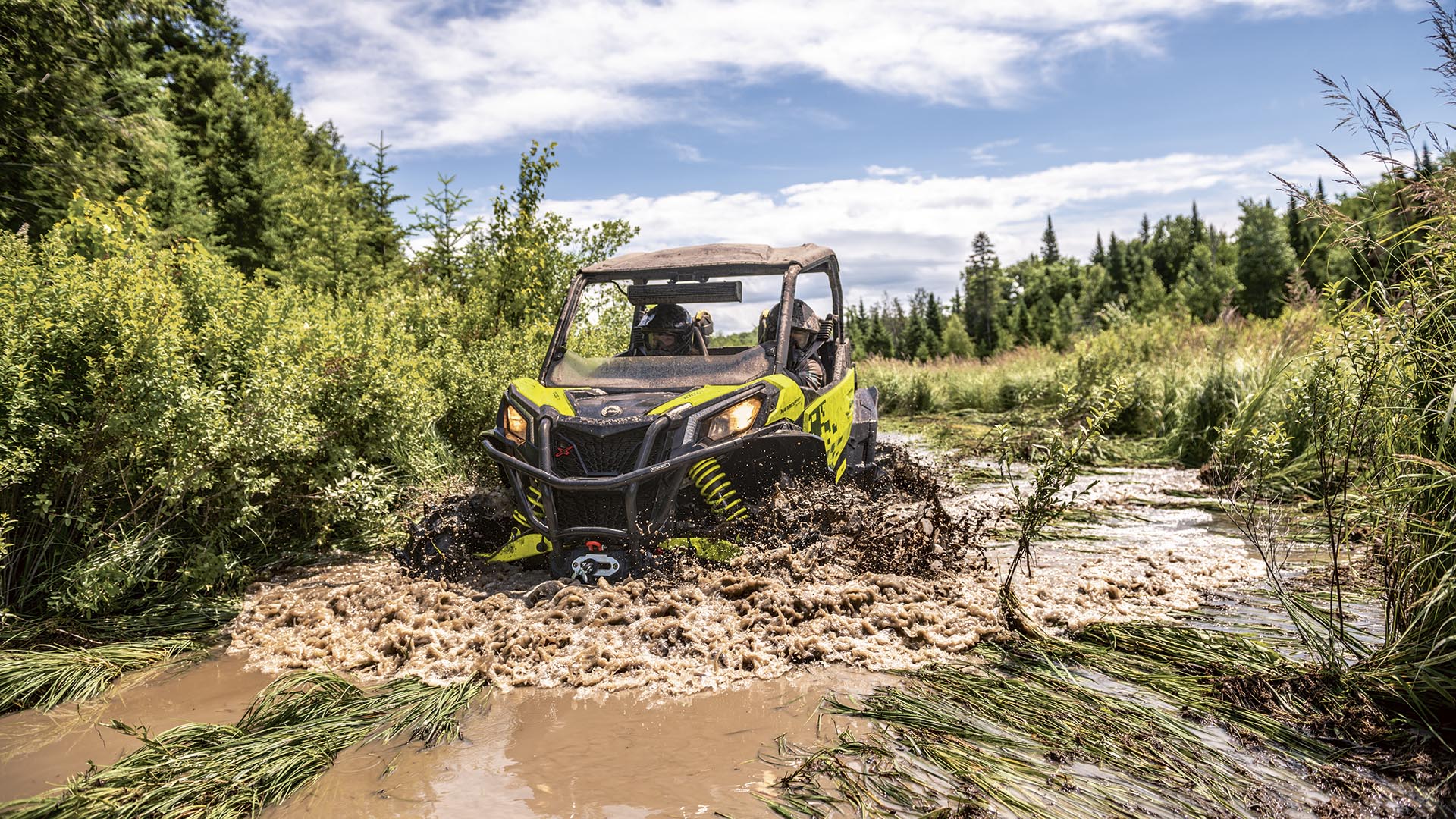 Can-Am Maverick Trail side-by-side in the mud