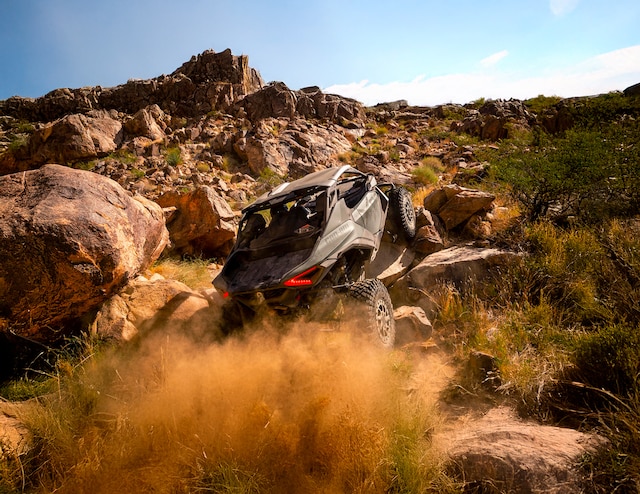 A 2026 Can-Am Maverick R X RC rock crawling