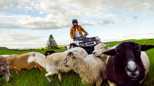 A 2026 Can-Am Outlander Electric on a farm
