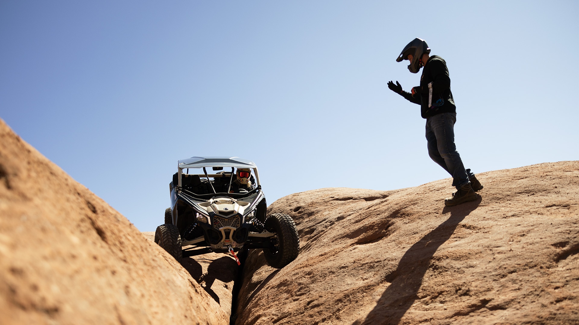 2026 Can-Am Maverick X3 RC rolling across numerous rocks 