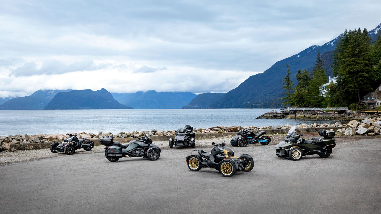2023 Can-Am Ryker, Spyder and Spyder RT models with a view on the lake and moutains