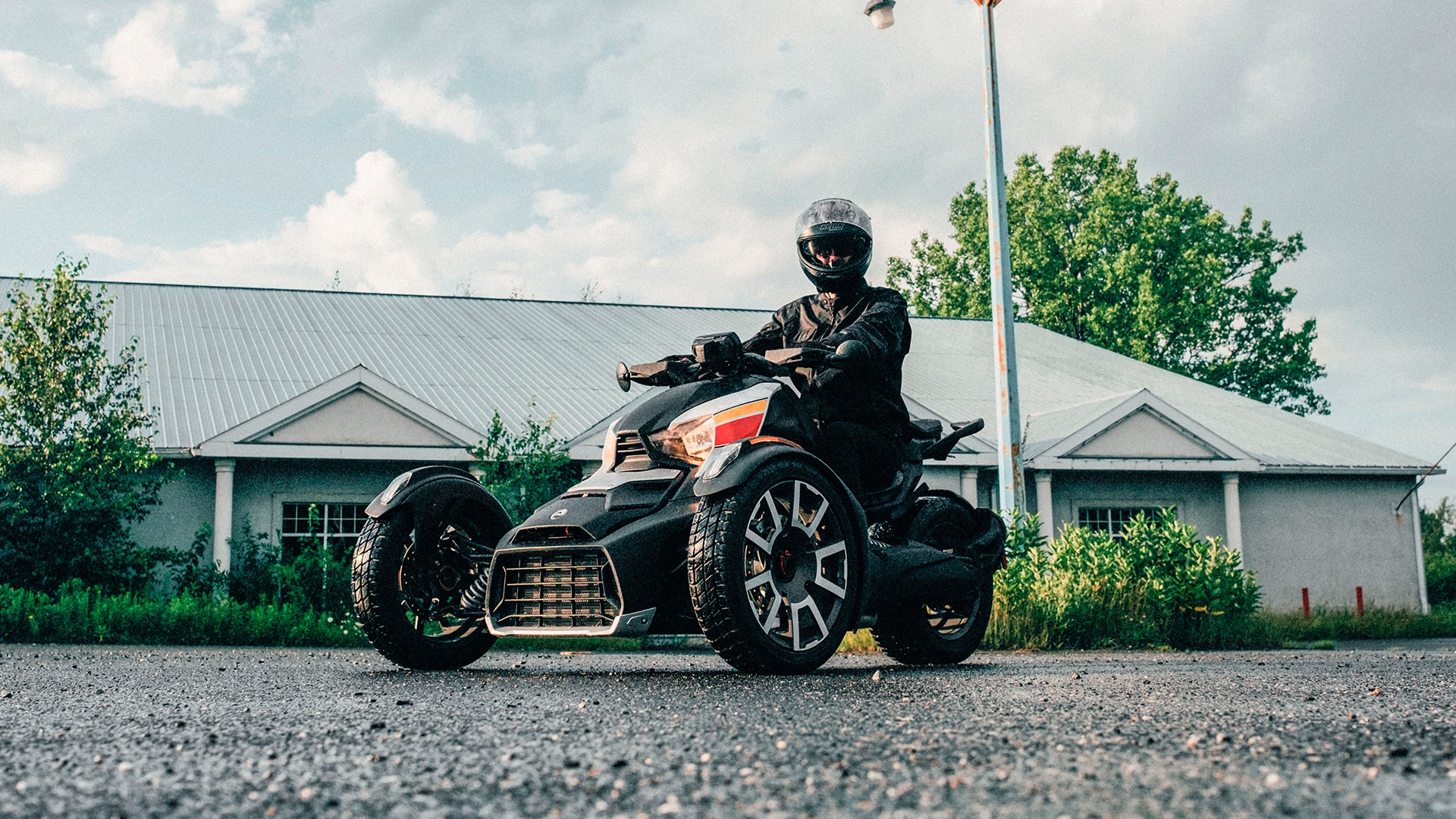 Rider parked with his 2021 Can-Am Ryker 3-wheel vehicle
