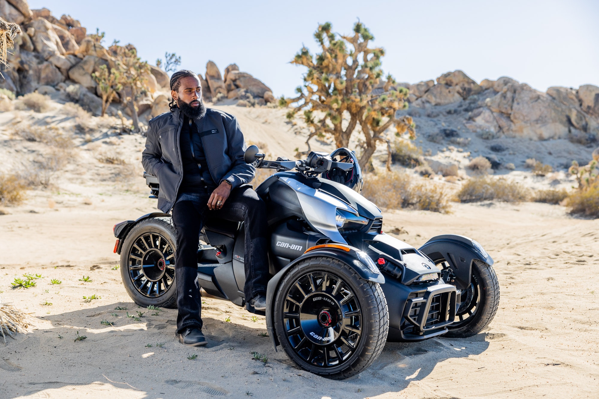 Motorcyclist sitting on a Can-Am Ryker Rally 2023 on sand