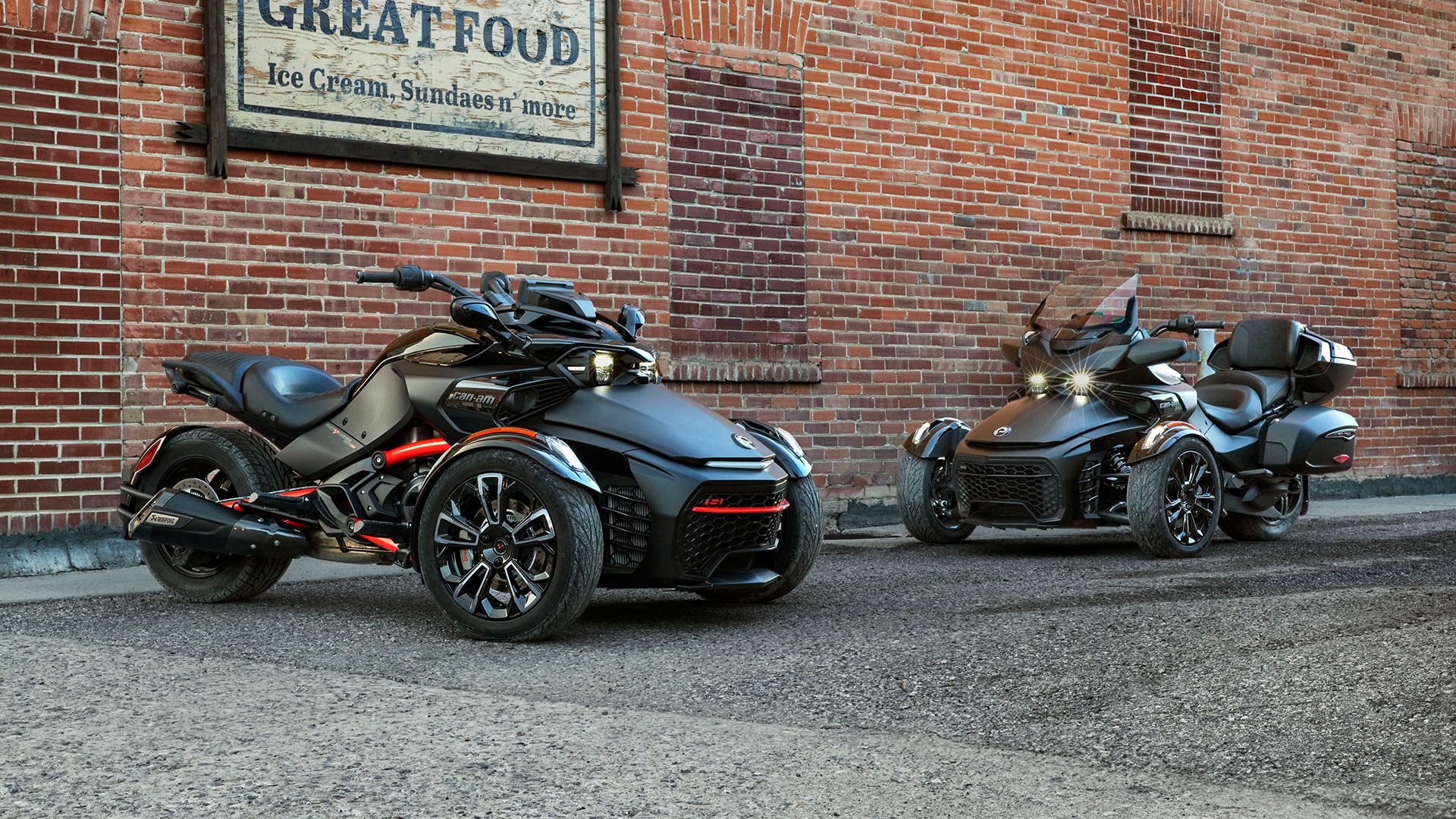 Can-Am Spyder F3 & Spyder RT parked in an industrial alley