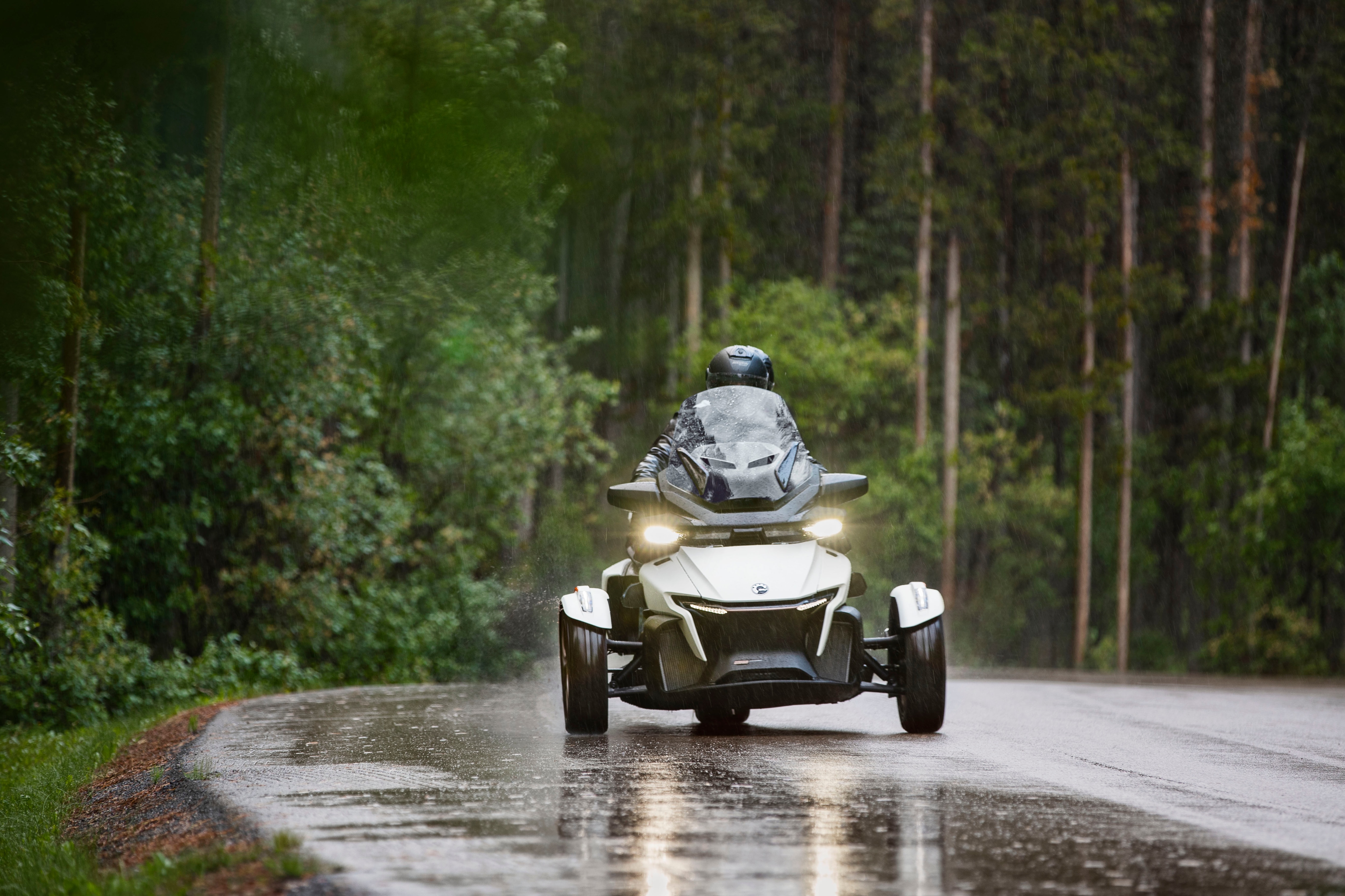 View of a Can-Am Spyder RT Sea-To-Sky in action under the rain