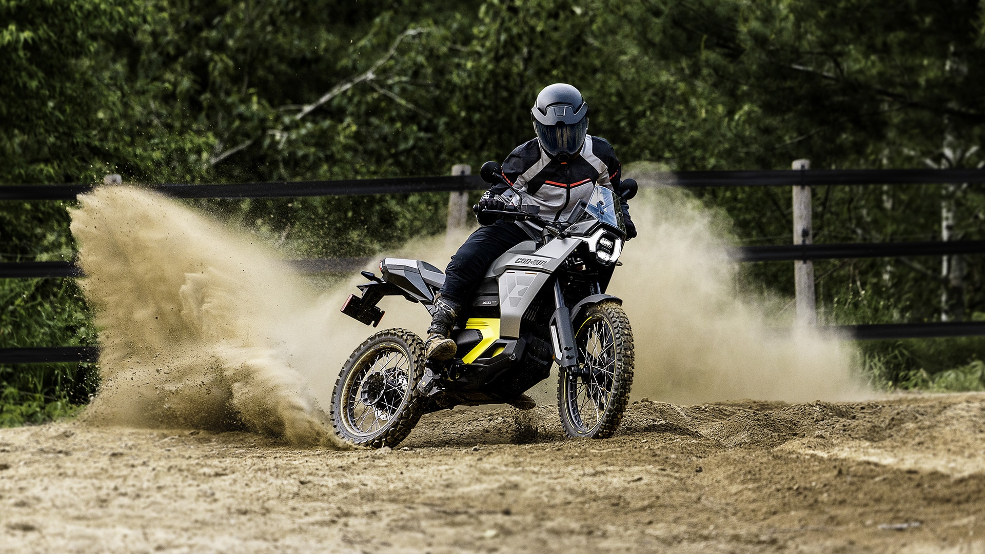 A Can-Am Origin electric motorcycle in action, leaving dust behind