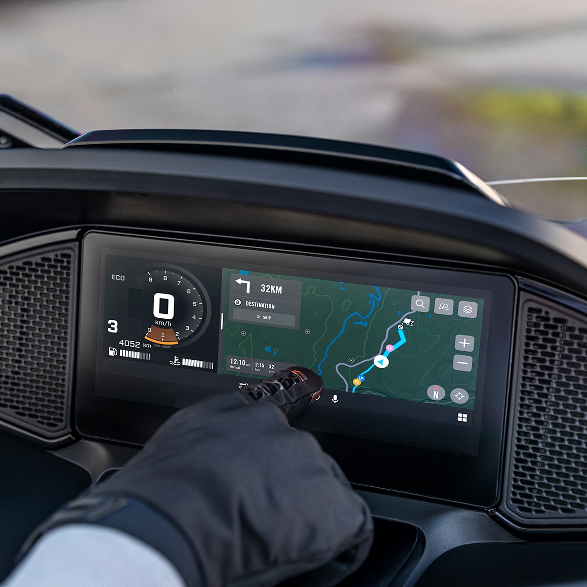 The touchscreen displaying a navigation route on a Can-Am 3-wheel